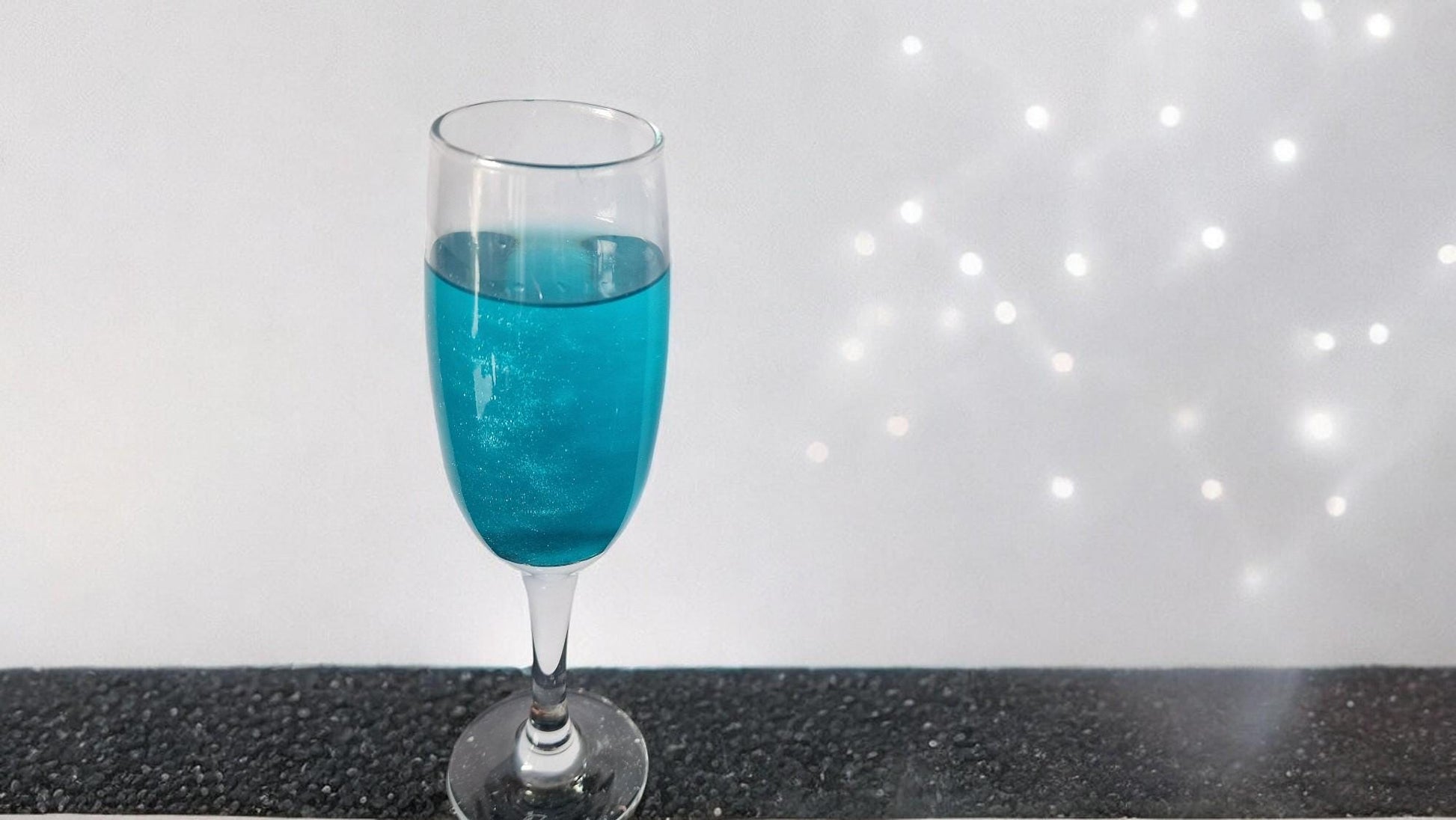 Candy floss with edible gold and silver glitter, displayed as a party drink topper for weddings and cocktail nights