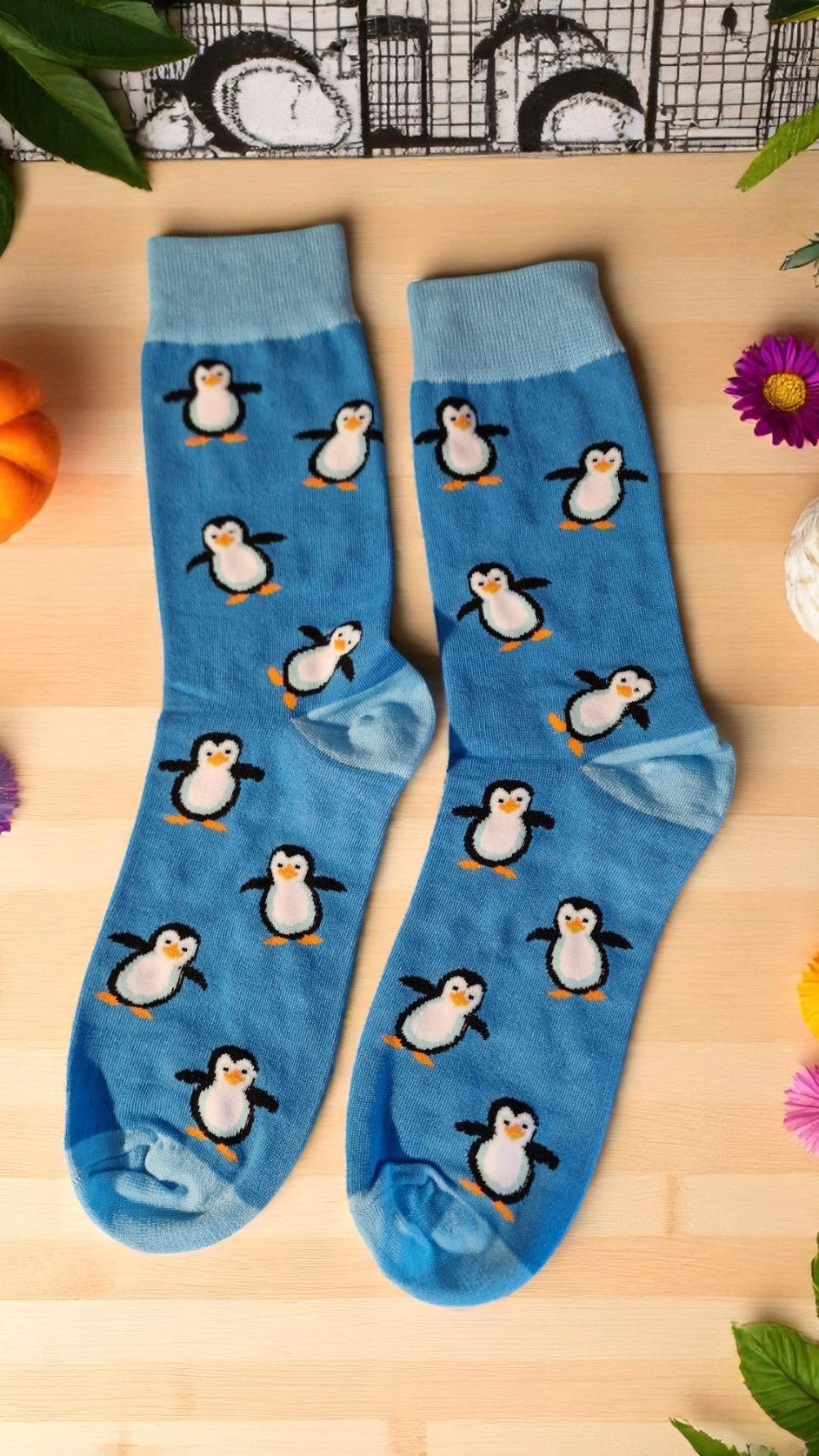 Blue penguin-themed socks in a stylish gift box with tag – cozy novelty socks for adults, perfect penguin lover gift