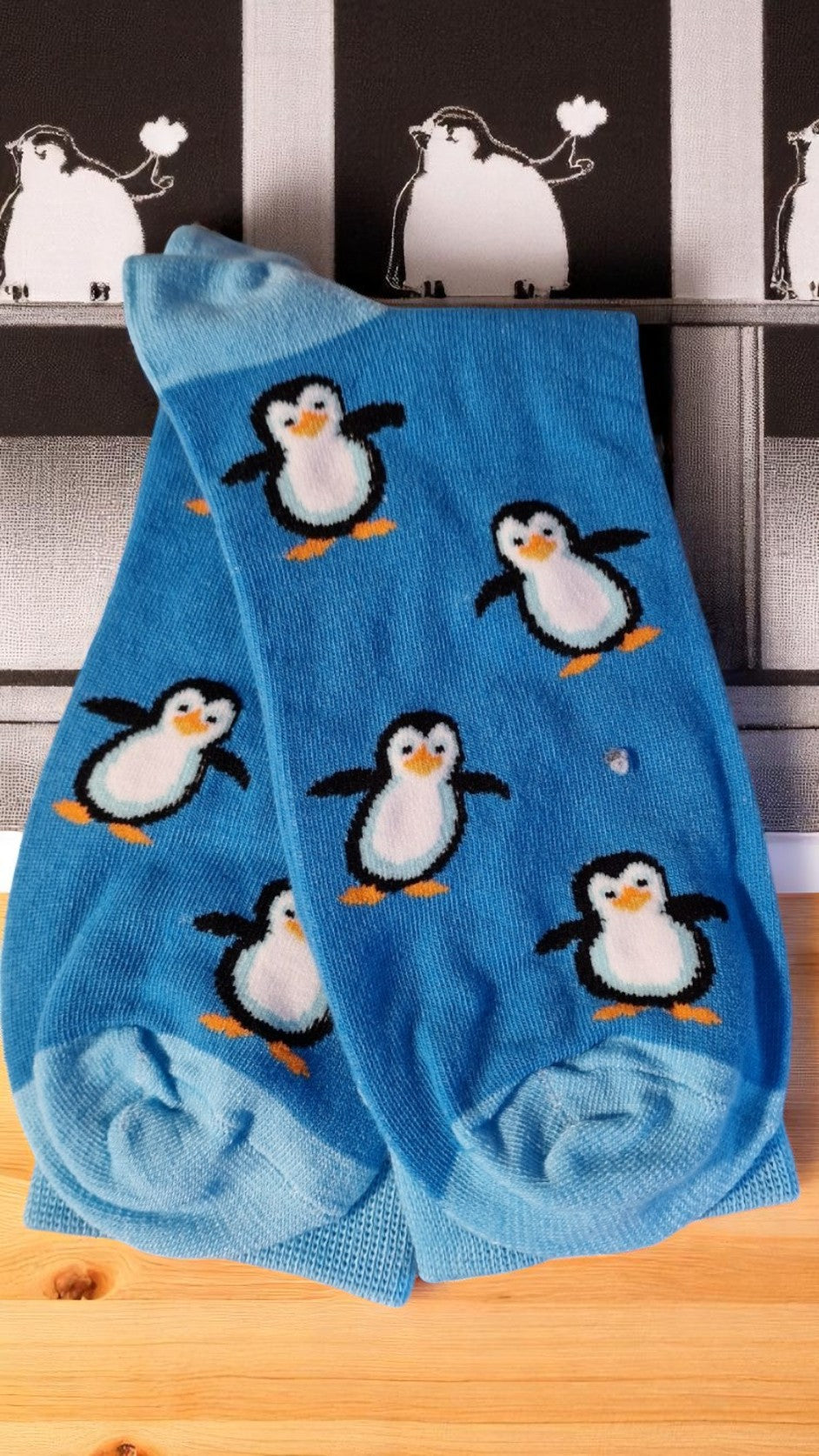 Blue penguin-themed socks in a stylish gift box with tag – cozy novelty socks for adults, perfect penguin lover gift