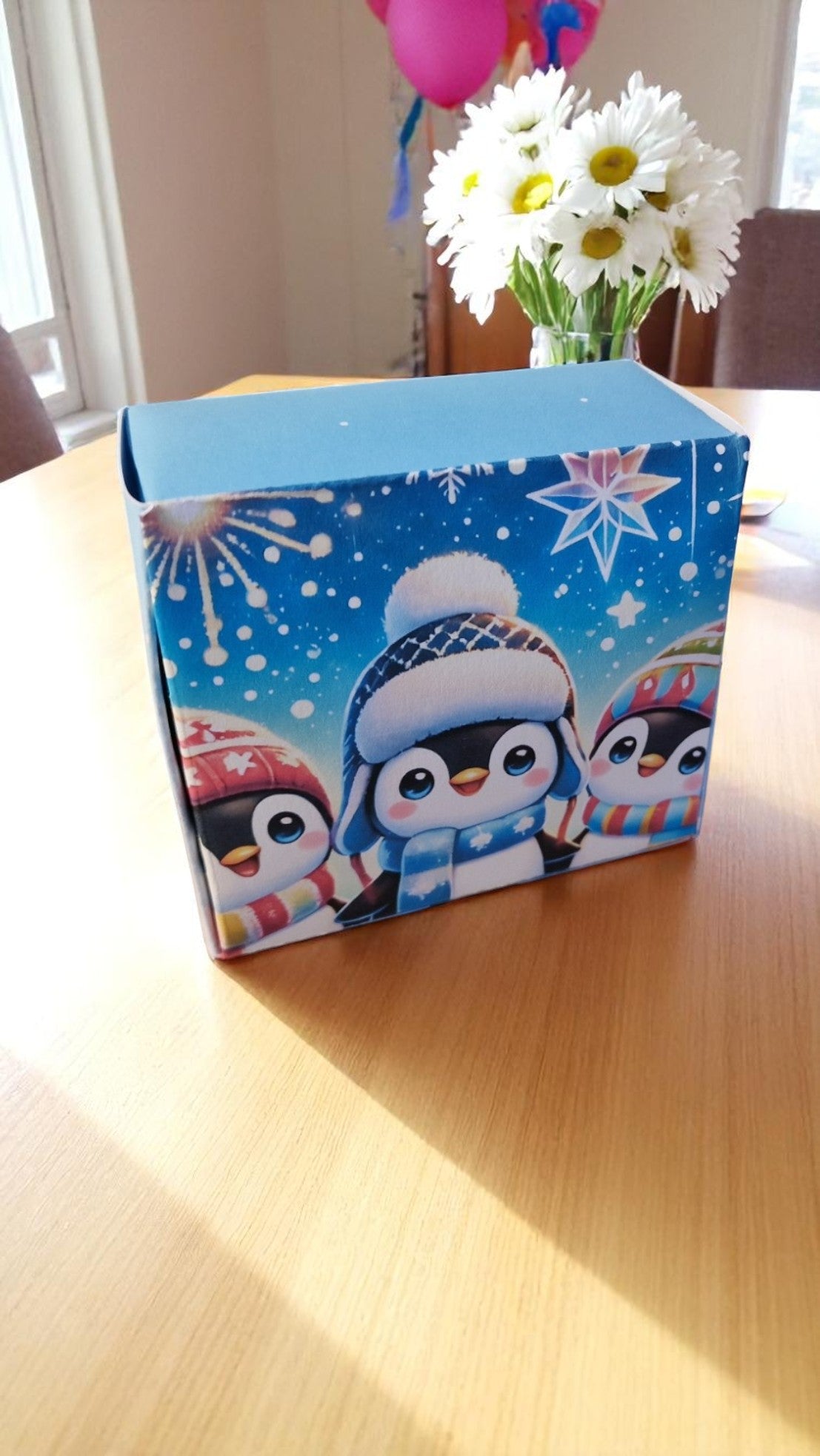 Blue penguin-themed socks in a stylish gift box with tag – cozy novelty socks for adults, perfect penguin lover gift