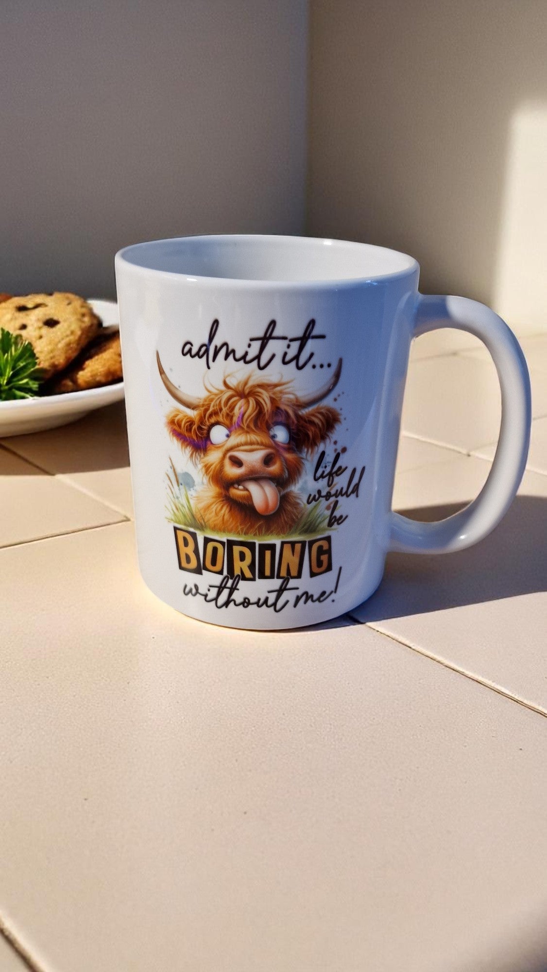 Mug with a cartoon cow and humorous text on a kitchen counter