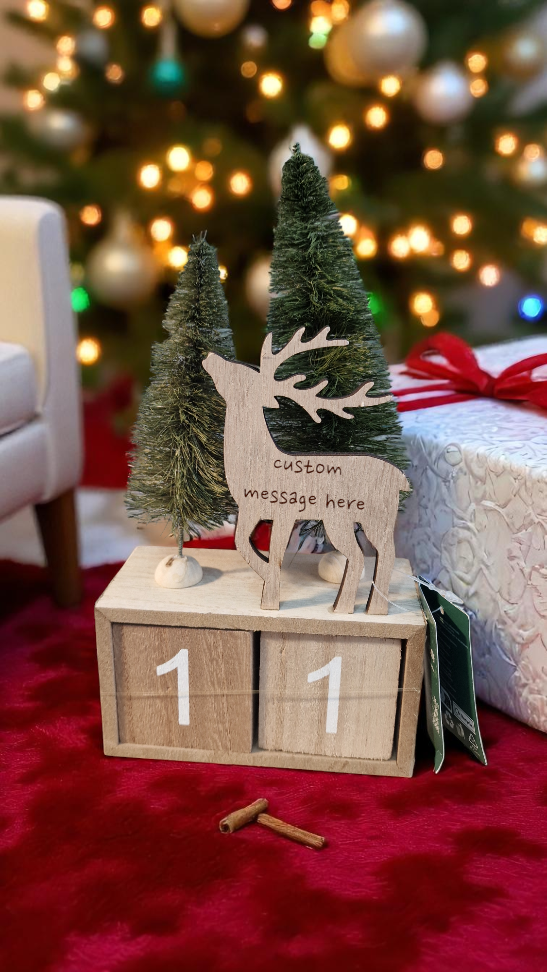 Custom engraved wooden advent calendar with reindeer and trees, 23cm high by 12cm wide, featuring two 5.5cm date cubes.