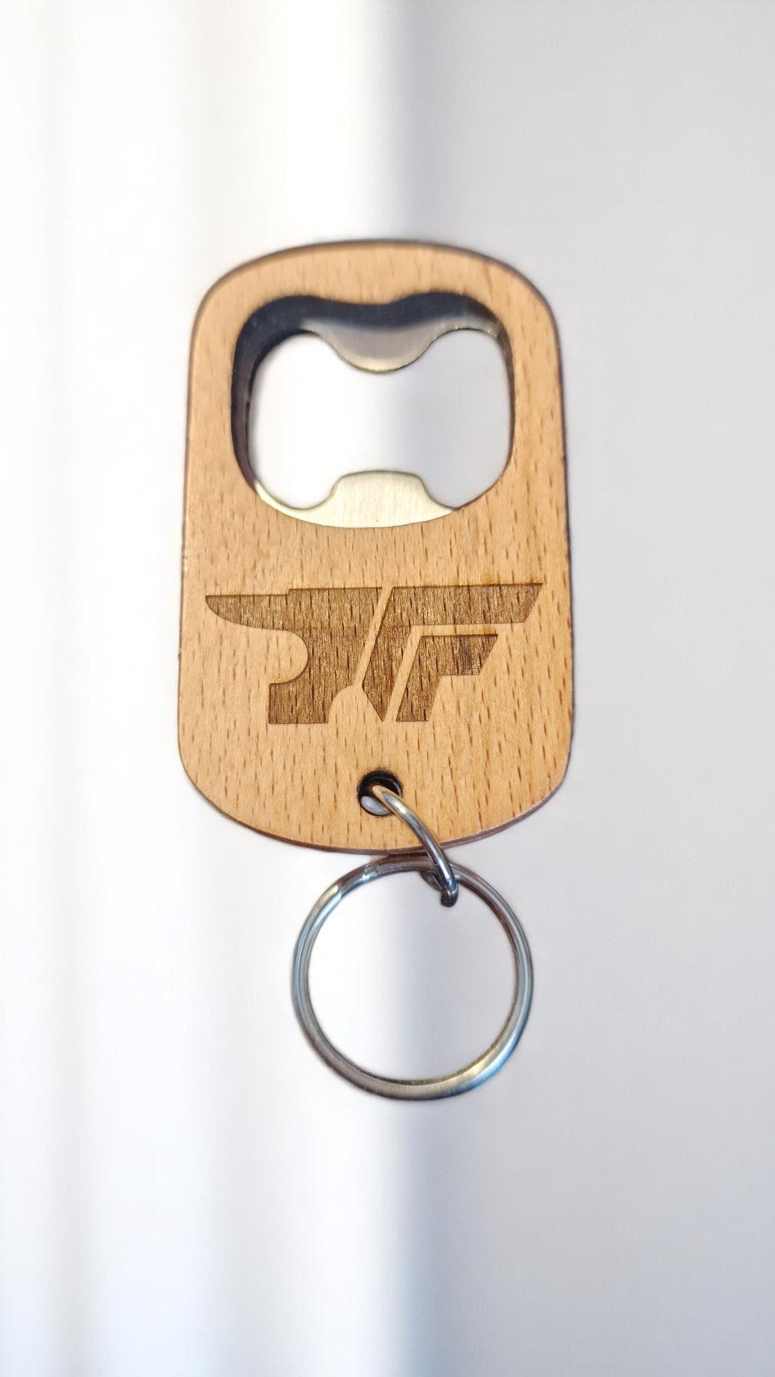 Wooden bottle opener keychain with a logo on a white background