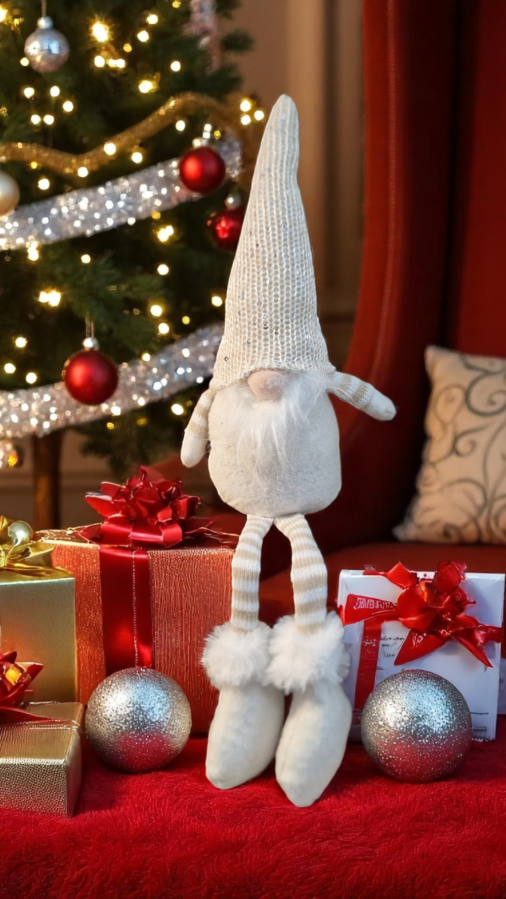 50cm Christmas gnome with red-and-white striped hat, white beard, and personalised wooden heart, sitting on a fireplace with festive lights in the background