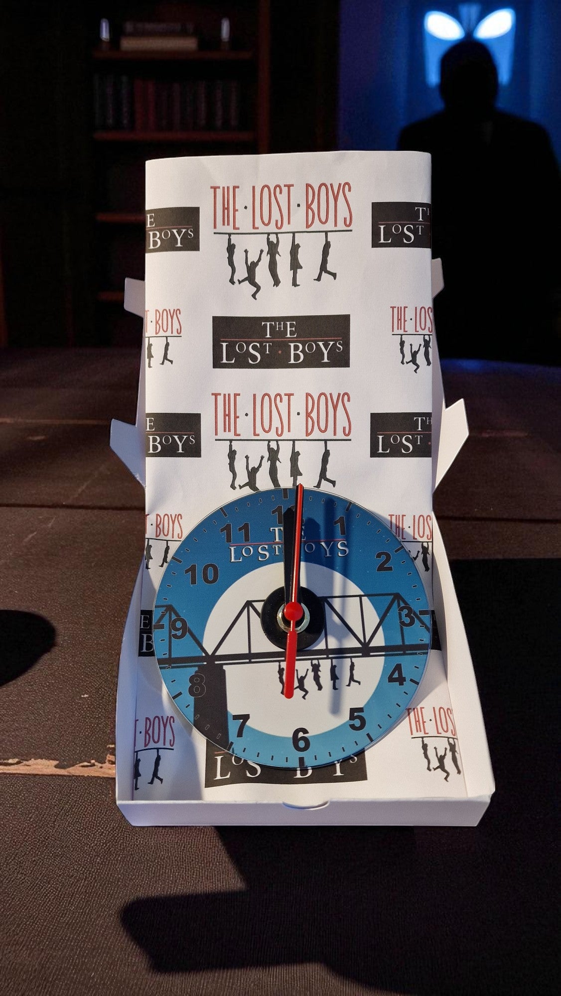 Wall clock with 'The Lost Boys' design on a dark background