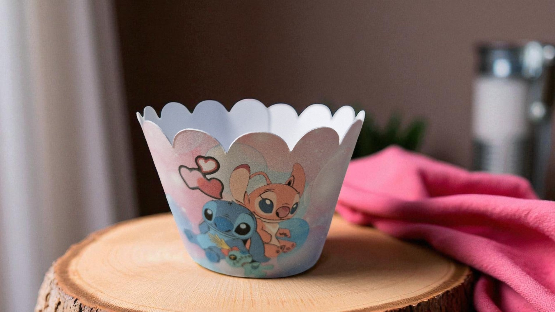 Set of 12 colourful pre-cut cupcake wrappers in two designs, made from cardstock, shown flat and assembled for birthday party decoration. Not edible