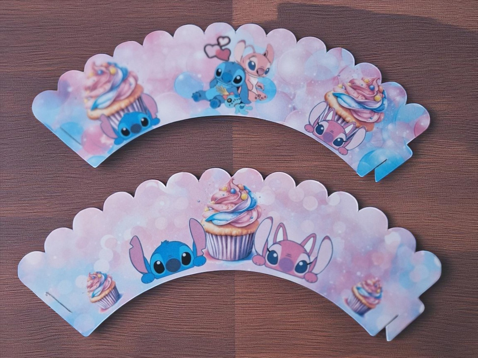 Set of 12 colourful pre-cut cupcake wrappers in two designs, made from cardstock, shown flat and assembled for birthday party decoration. Not edible