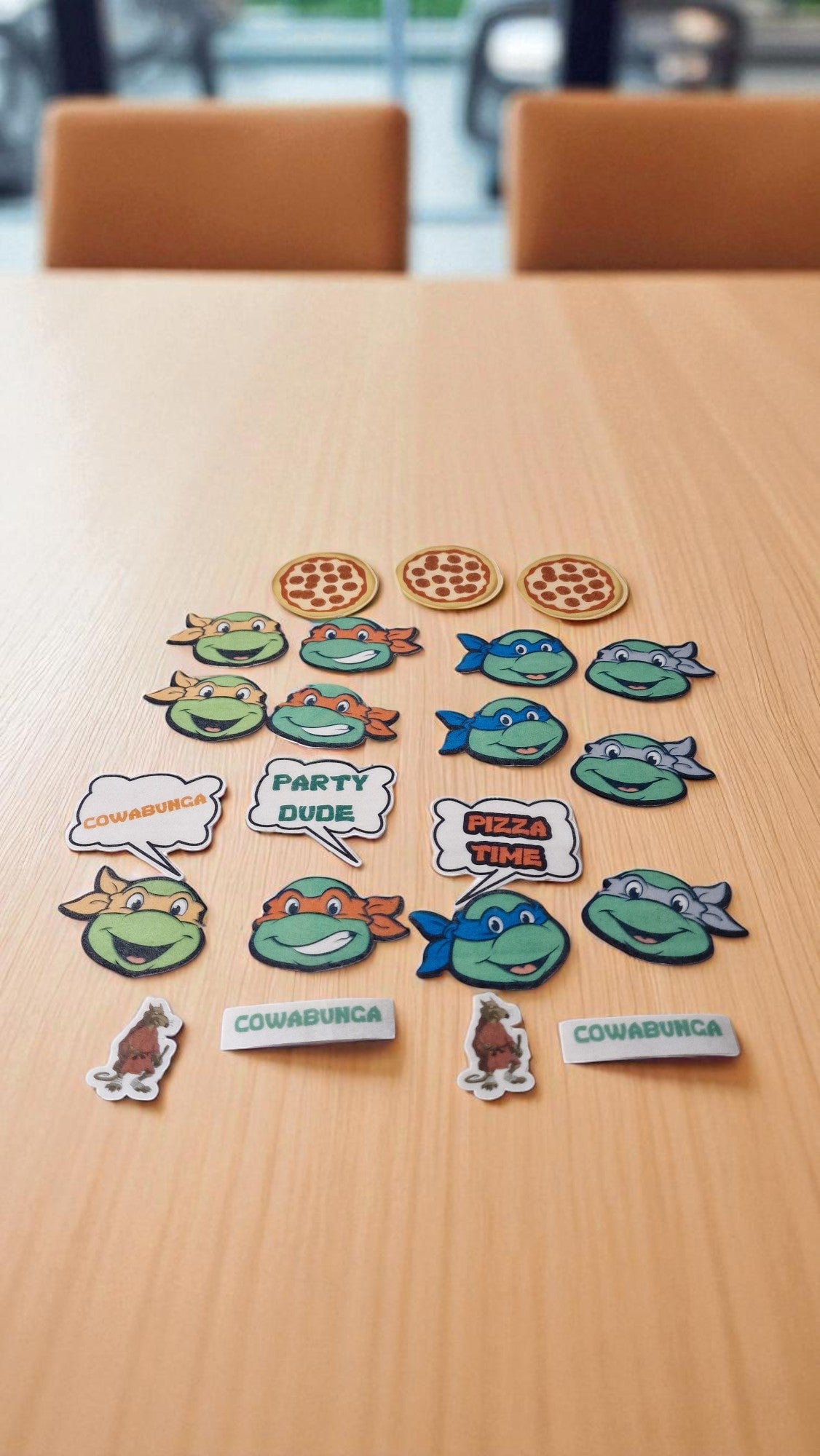 Set of cartoon character stickers on a wooden table
