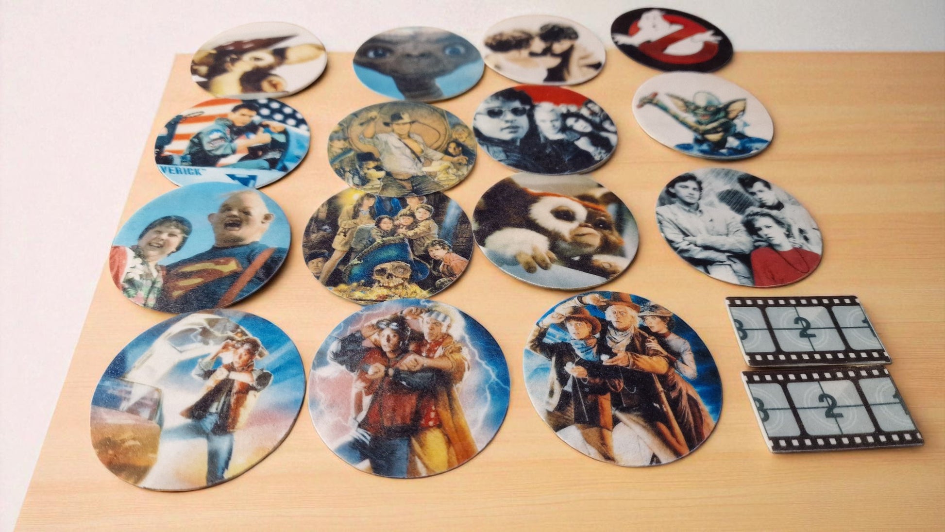 Collection of circular images on a wooden surface with a clapperboard.