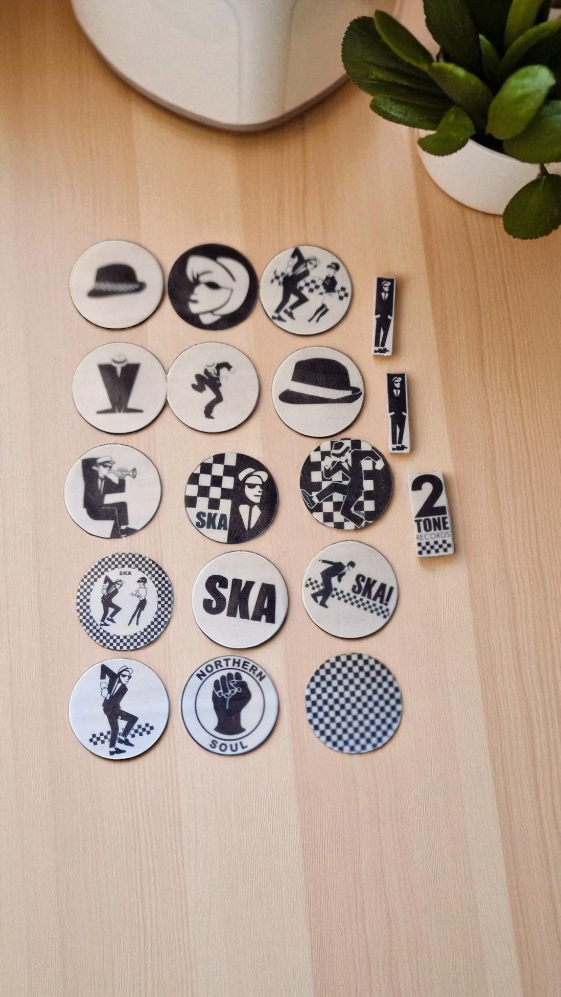 Set of 15 round and shaped edible cake toppers featuring ska hats, rude boys, checkerboards, Northern Soul fist, and 2 Tone logos, displayed on a wooden table.