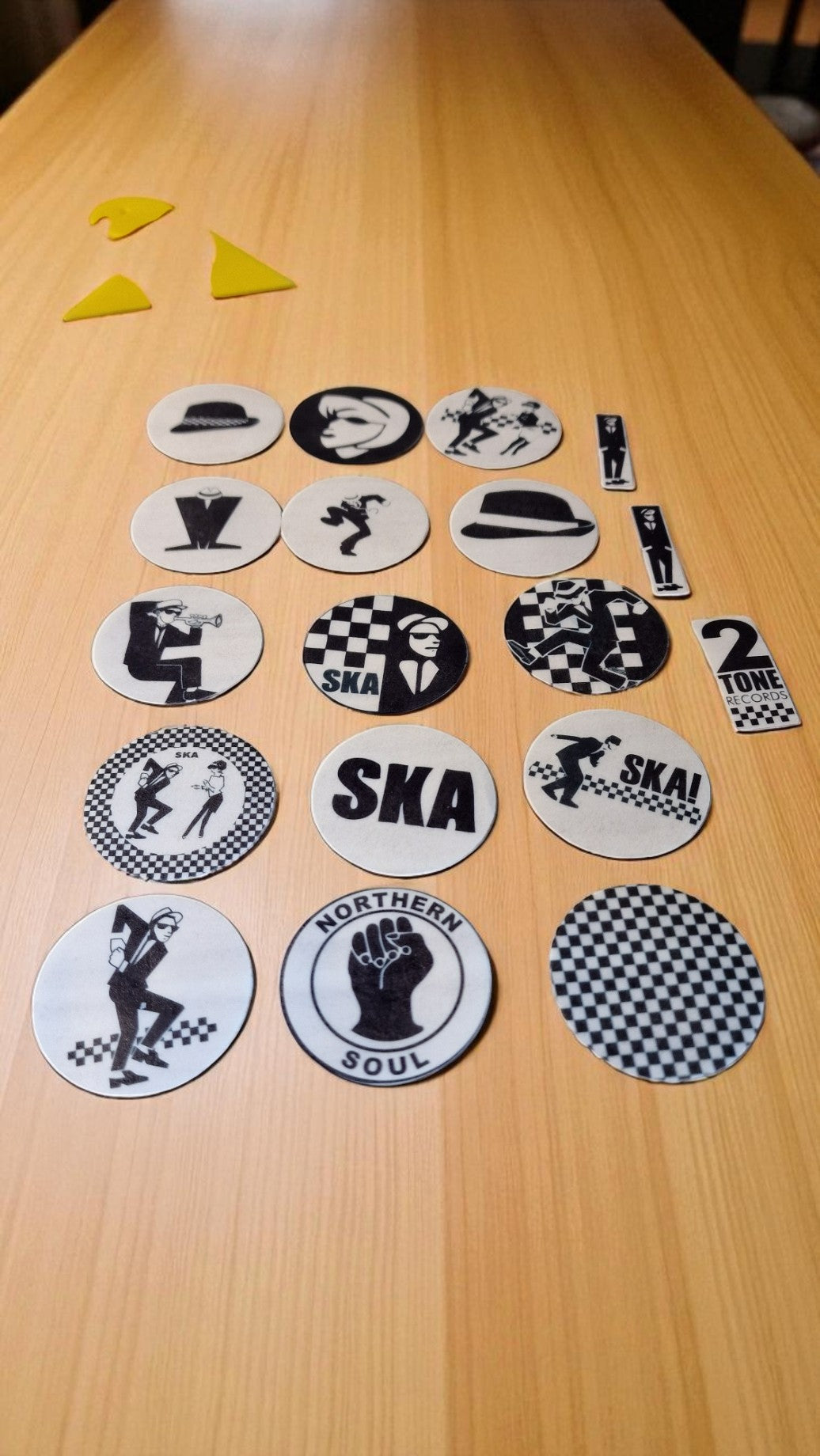Collection of Ska-themed coasters on a wooden table