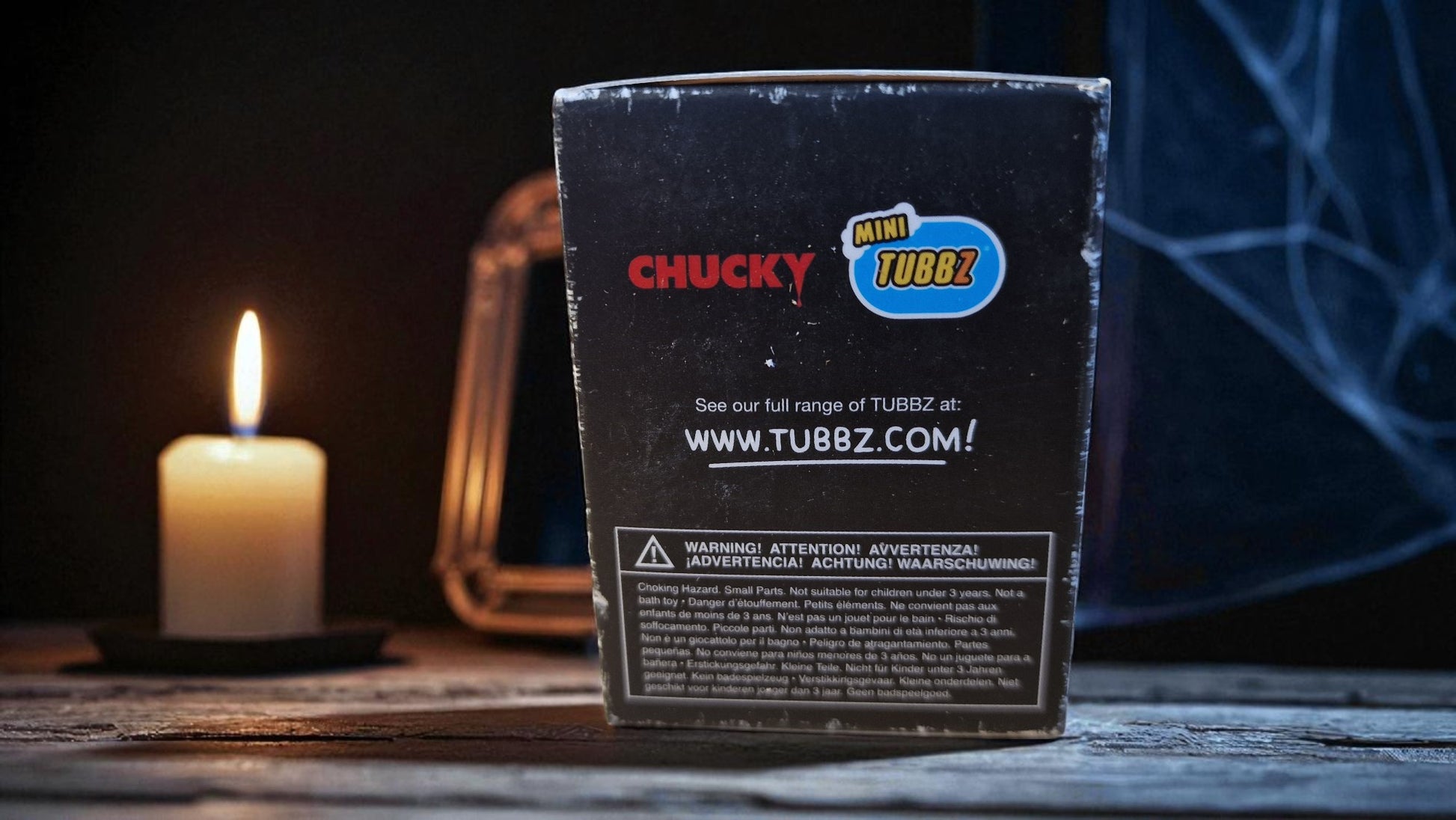 TUBBZ product packaging with a candle and mirror in the background