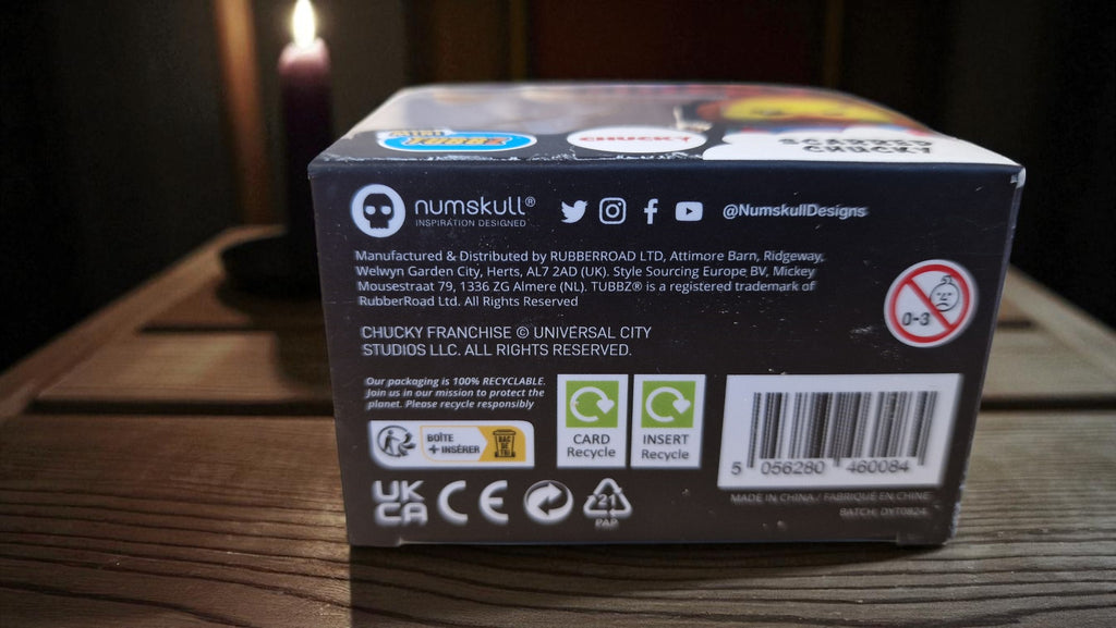 Back view of a Numskull product packaging on a wooden surface