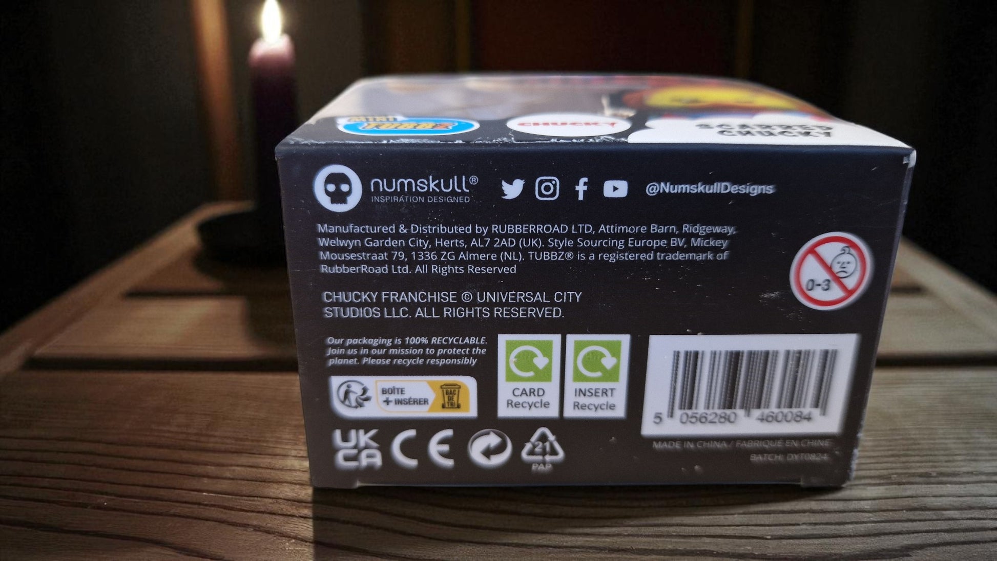 Back view of a Numskull product packaging on a wooden surface
