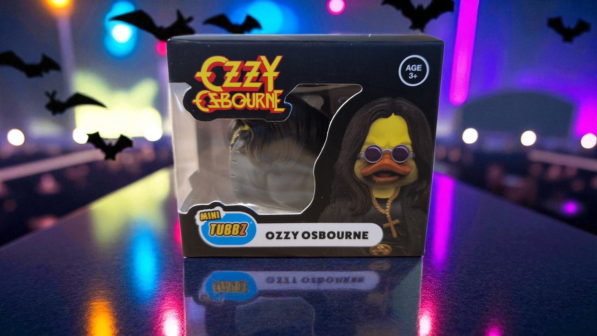 Ozzy Osbourne figurine in packaging with a colorful, blurred background