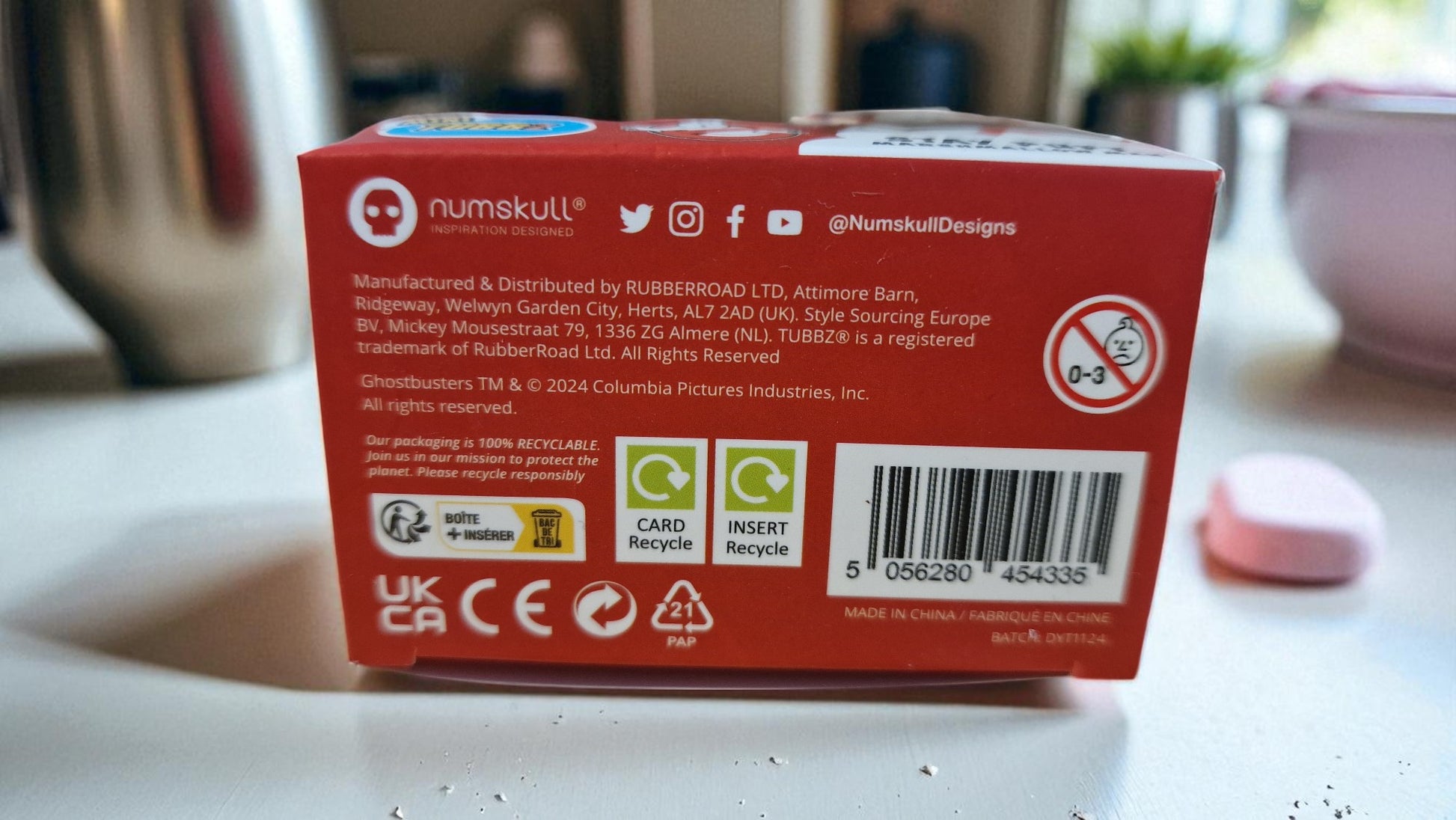 Red box with 'numskull' branding on a white surface