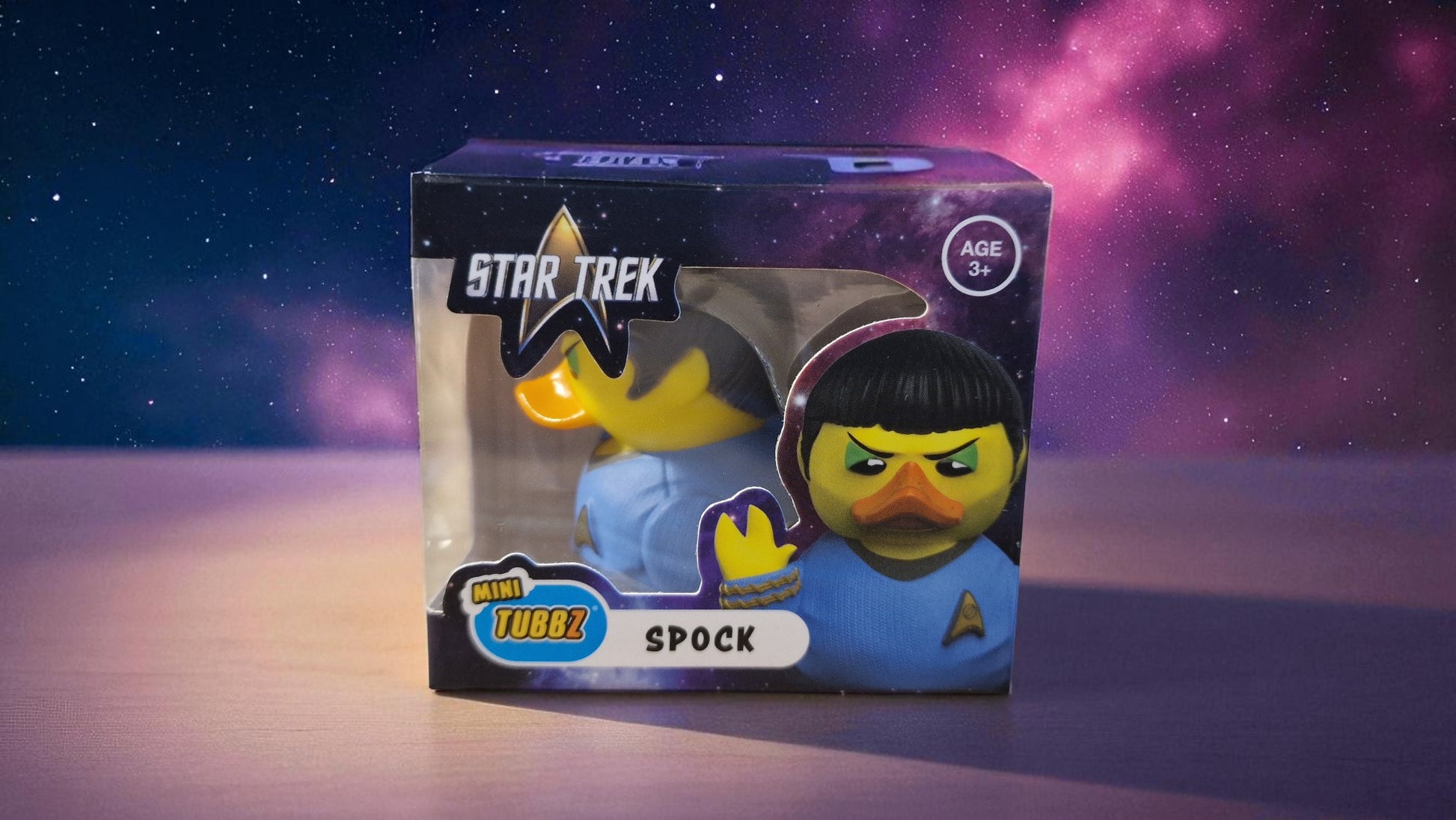 Star Trek Spock toy figure in packaging with a space-themed background