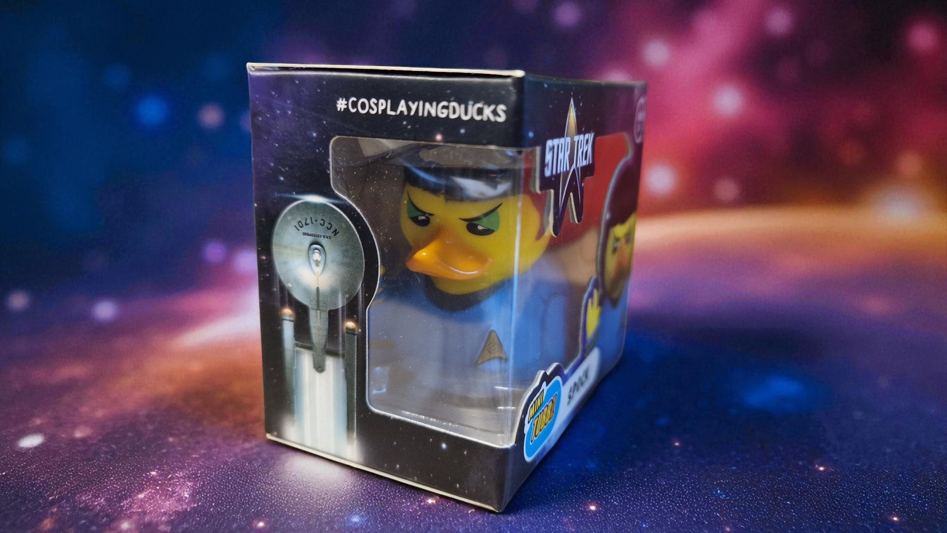 Star Trek-themed rubber duck in packaging with a space-themed background