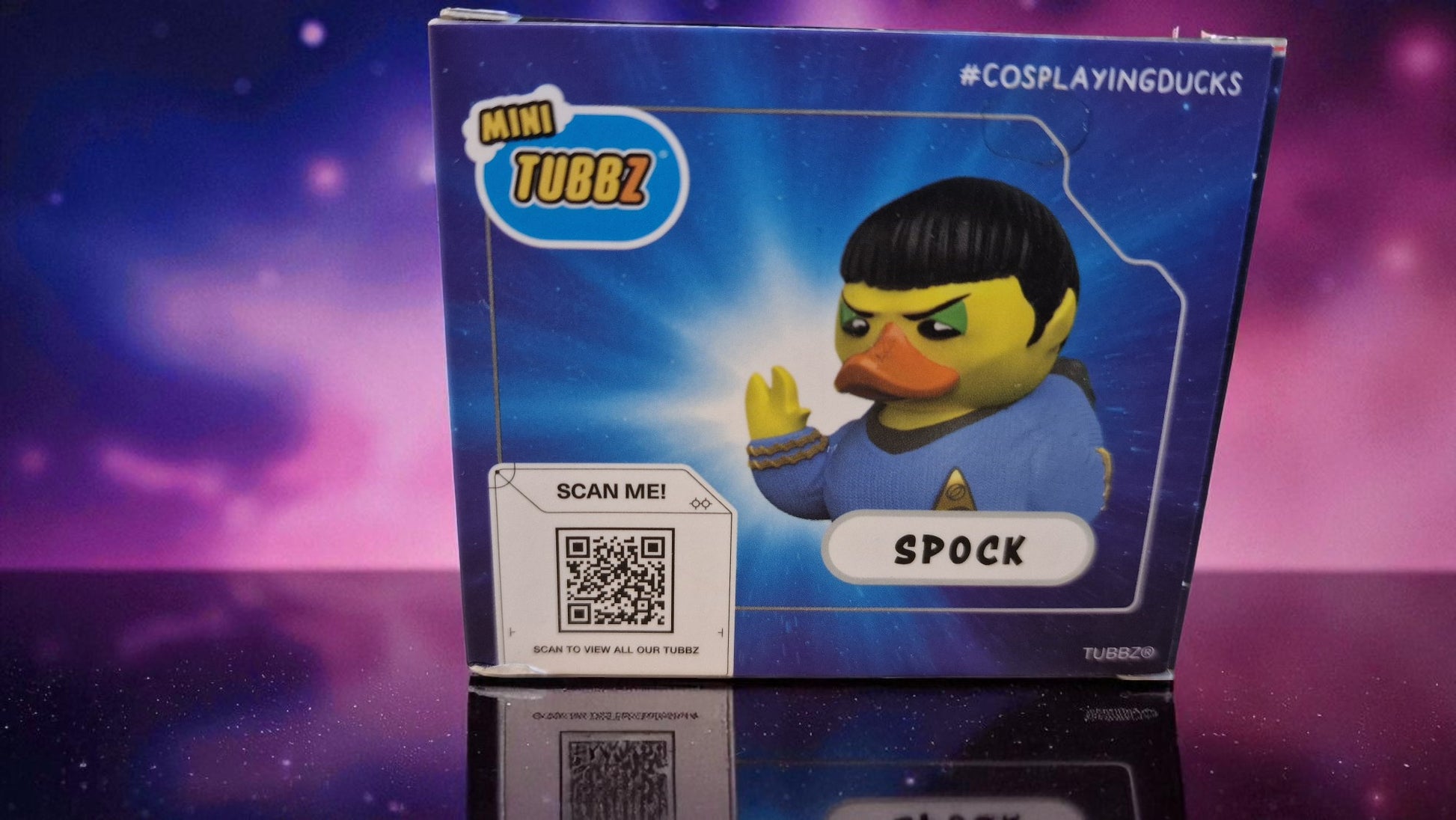 Toy figure of a duck dressed as Spock from Star Trek on a blue box with 'Mini Tubez' branding.