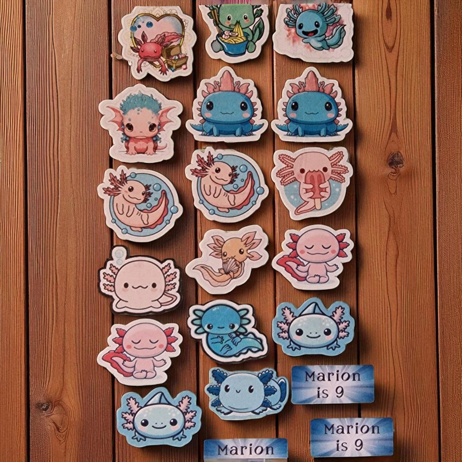 Collection of cute cartoon stickers on a wooden surface