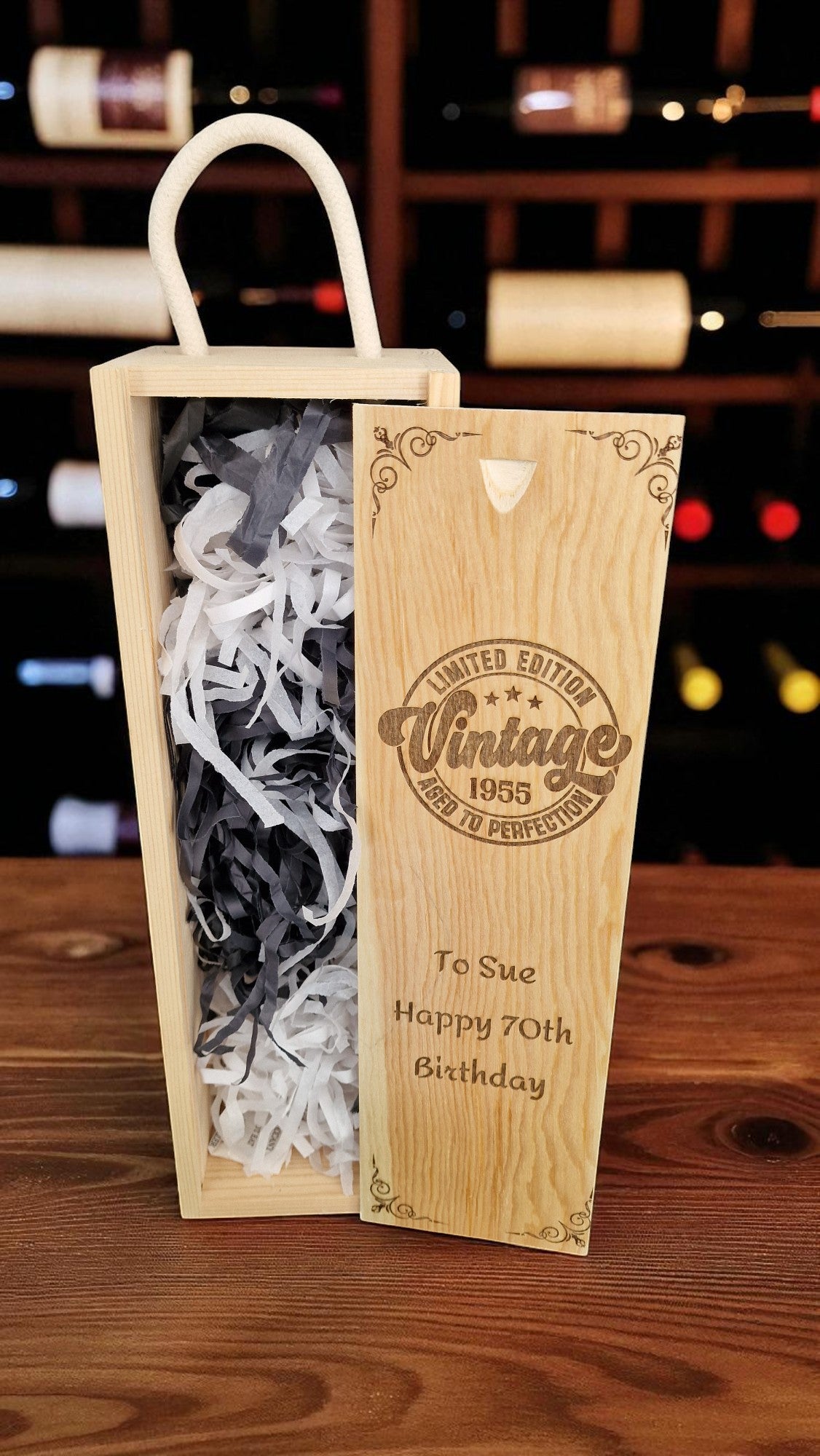 Wooden wine box with personalized message on a wooden surface