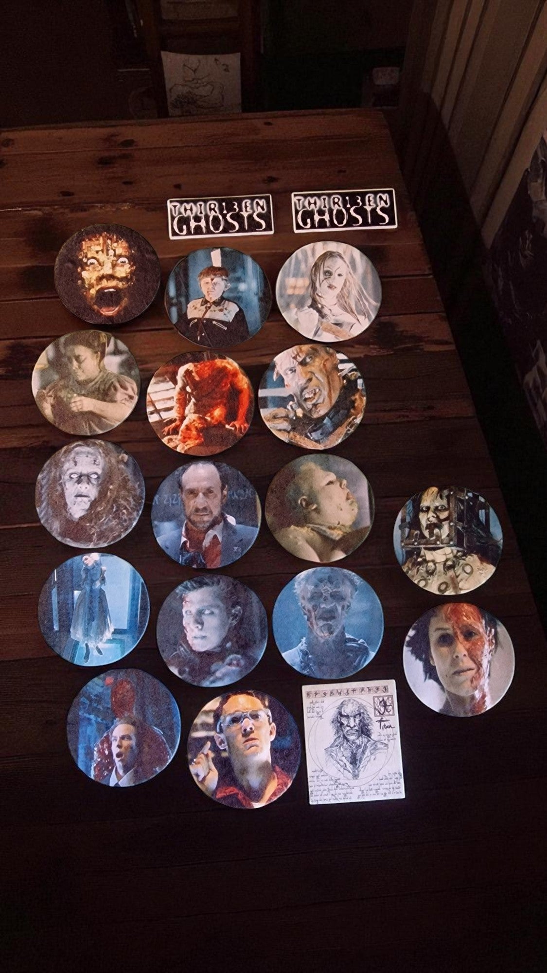 Collection of circular images on a wooden surface with 'Ghosts' branding.