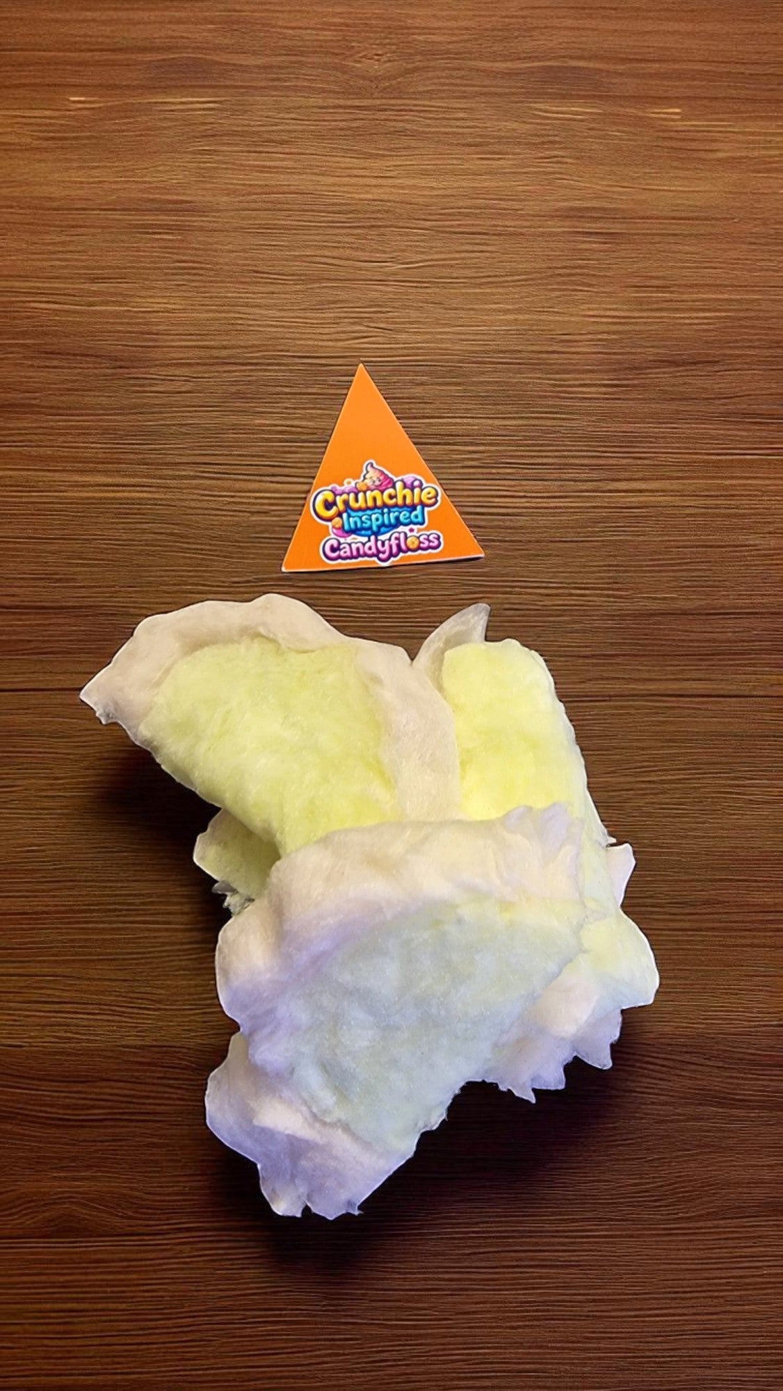White textured product on a wooden surface with a Crunchie branded triangle above it.