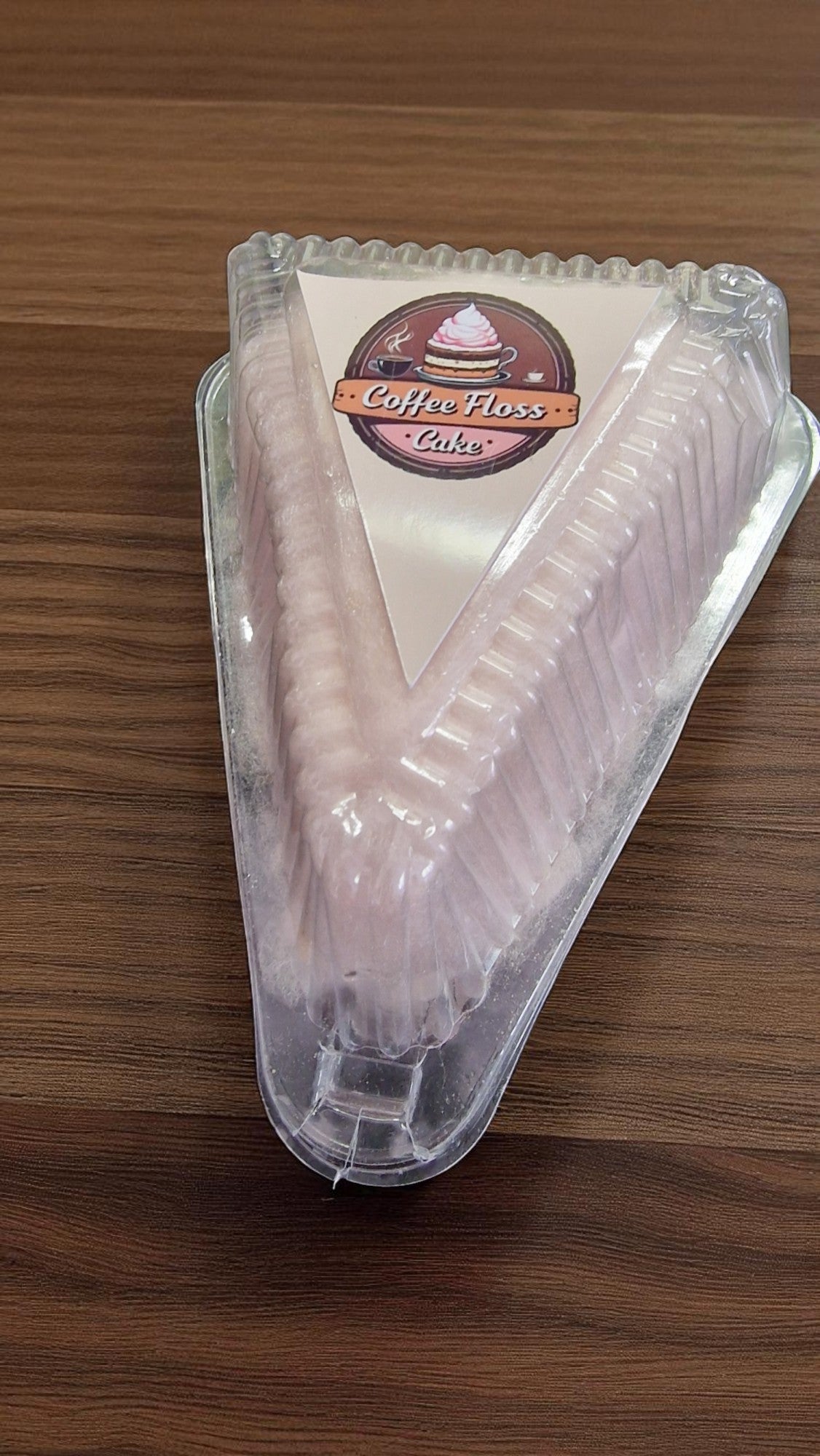 Packaged cake with a visible brand label on a wooden surface