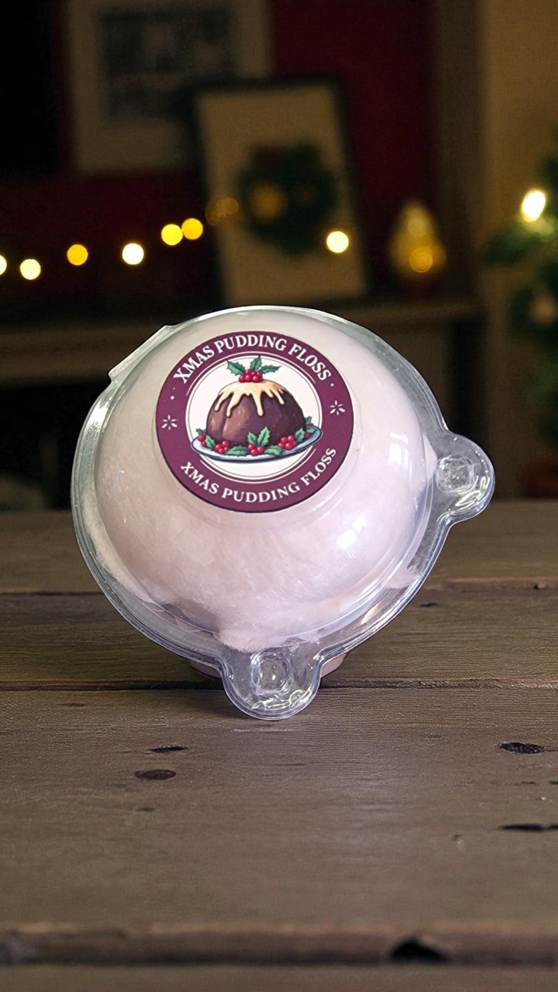 Xmas Pudding Flakes packaging on a wooden surface with a warm background