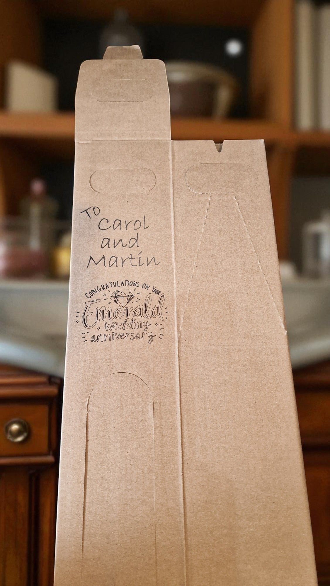 Brown paper bag with personalized text on a blurred background