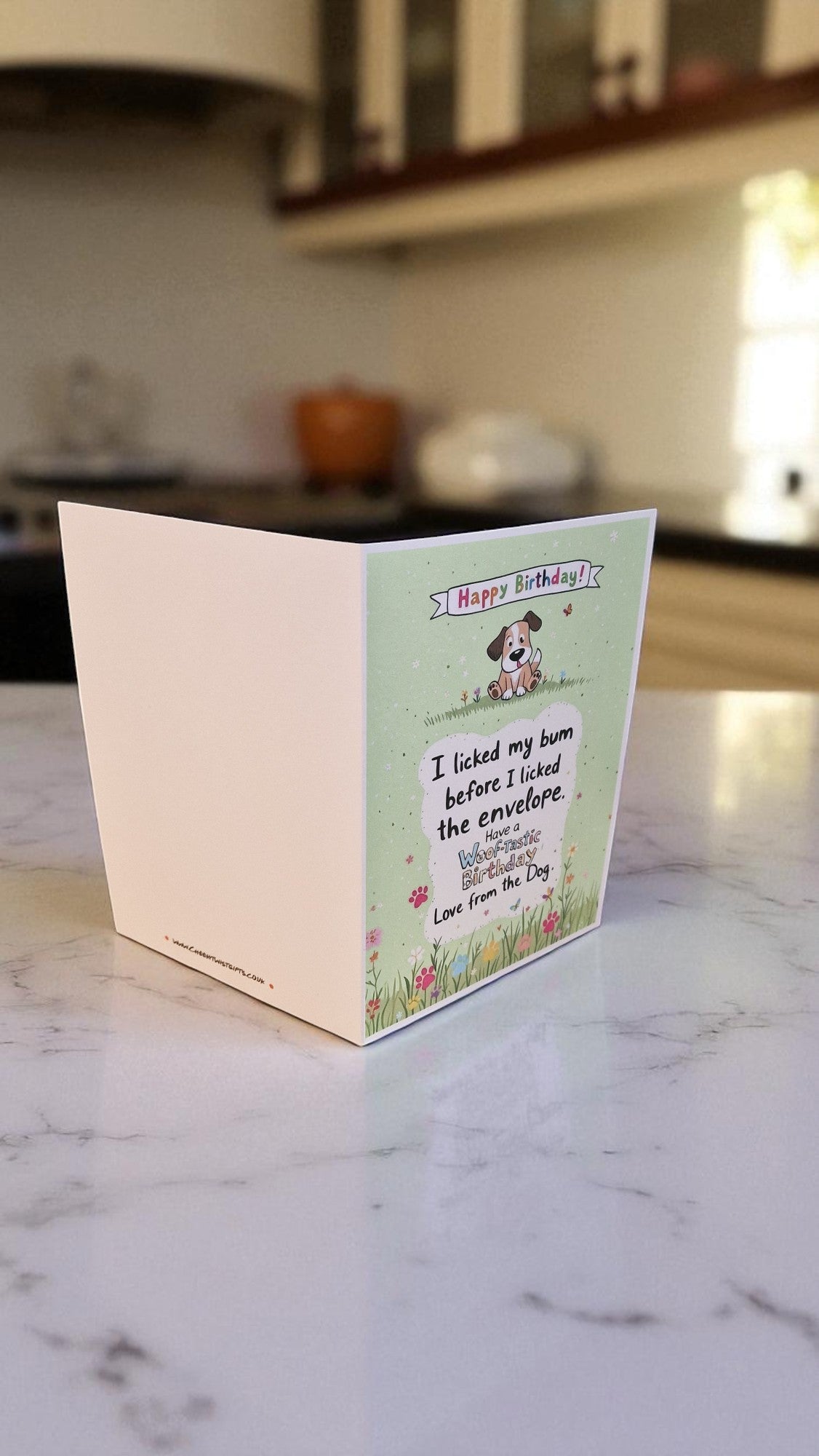 Greeting card with a cartoon dog on a kitchen counter