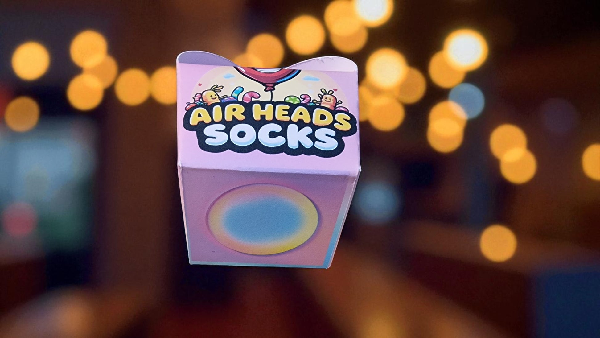 Box of Air Heads Socks with a blurred background