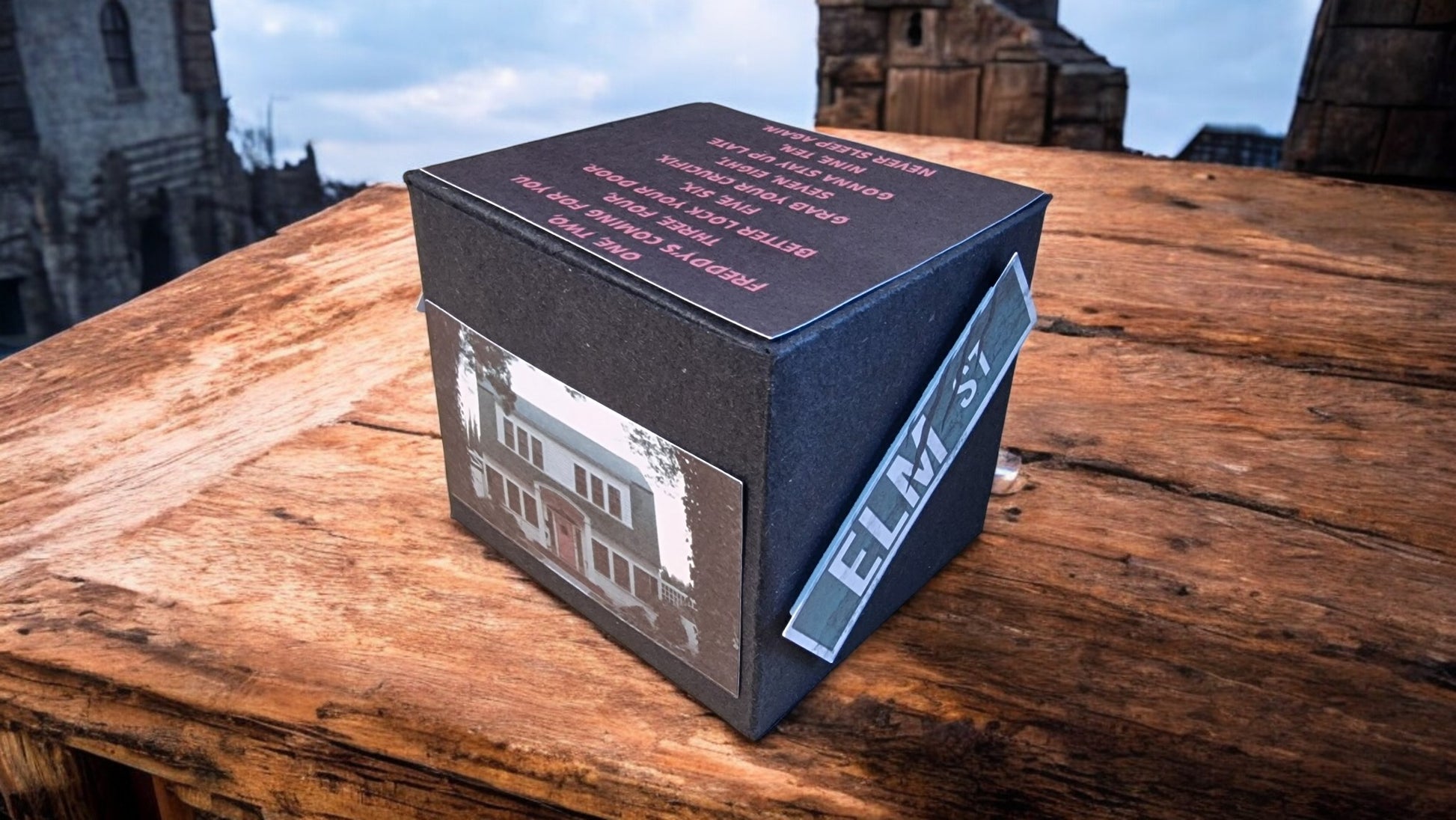 Black box with a reflective surface on a wooden surface
