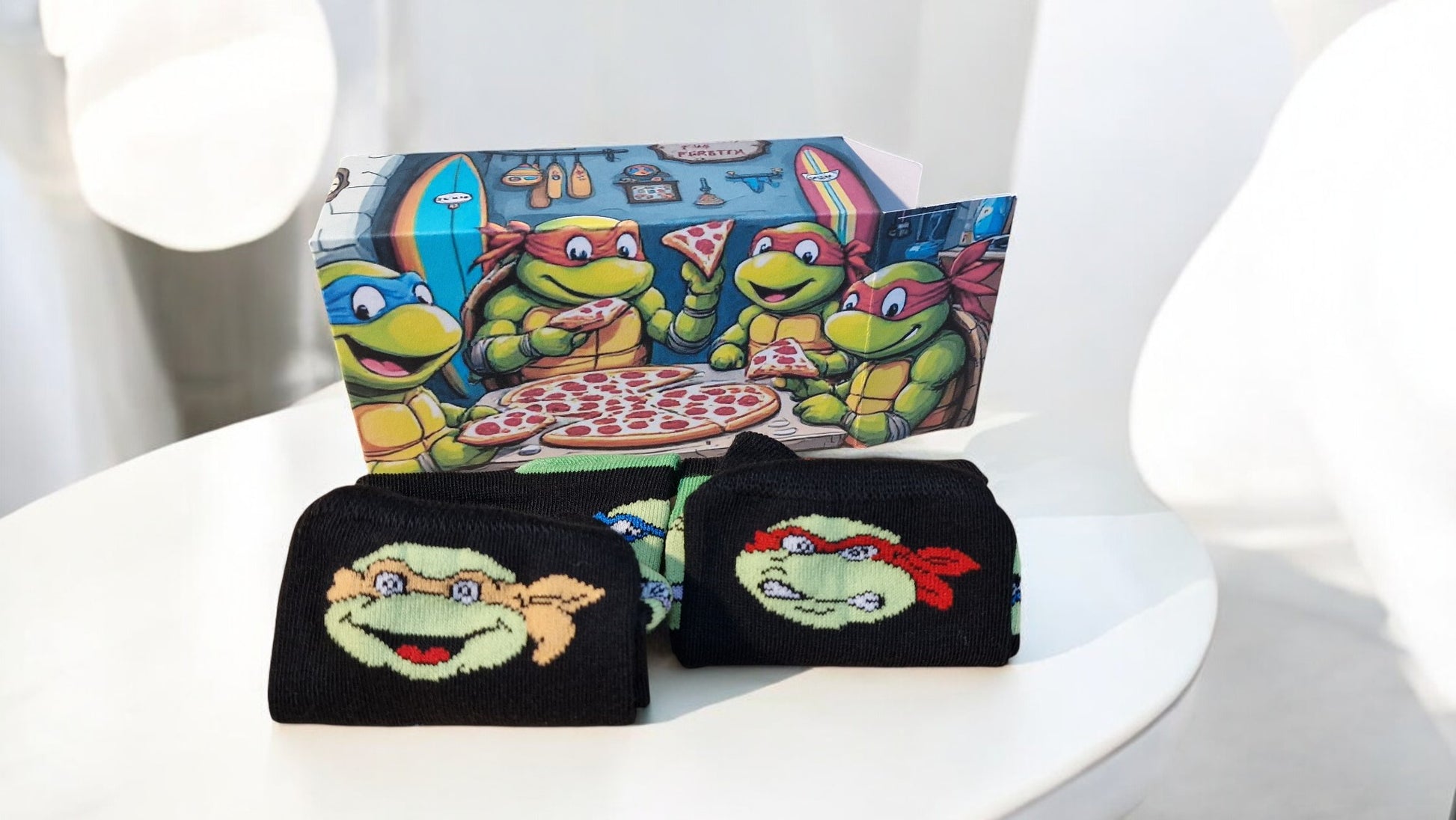 Two black pouches with cartoon turtle designs on a white chair.