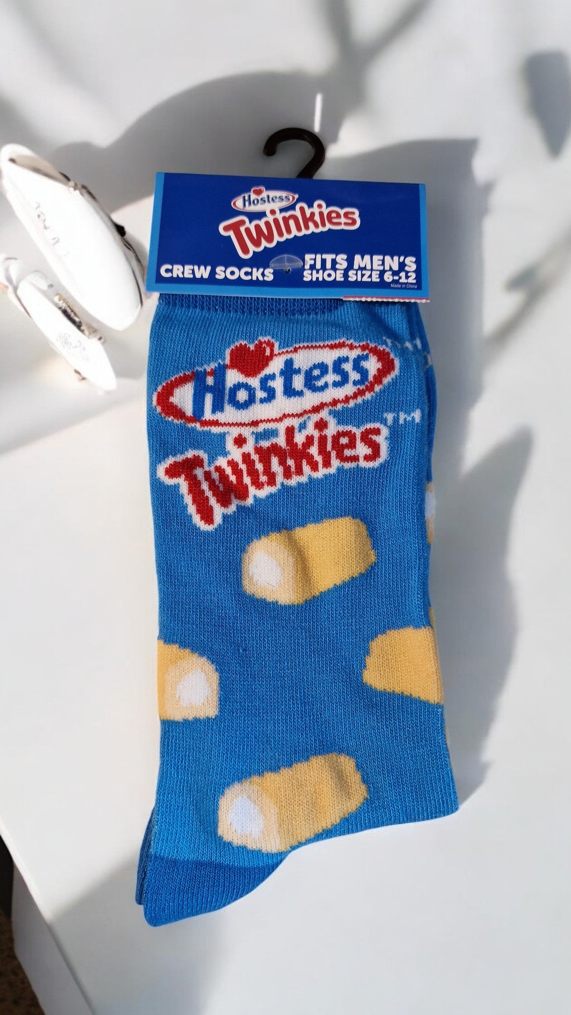 Blue sock with Hostess Twinkies branding on a white background