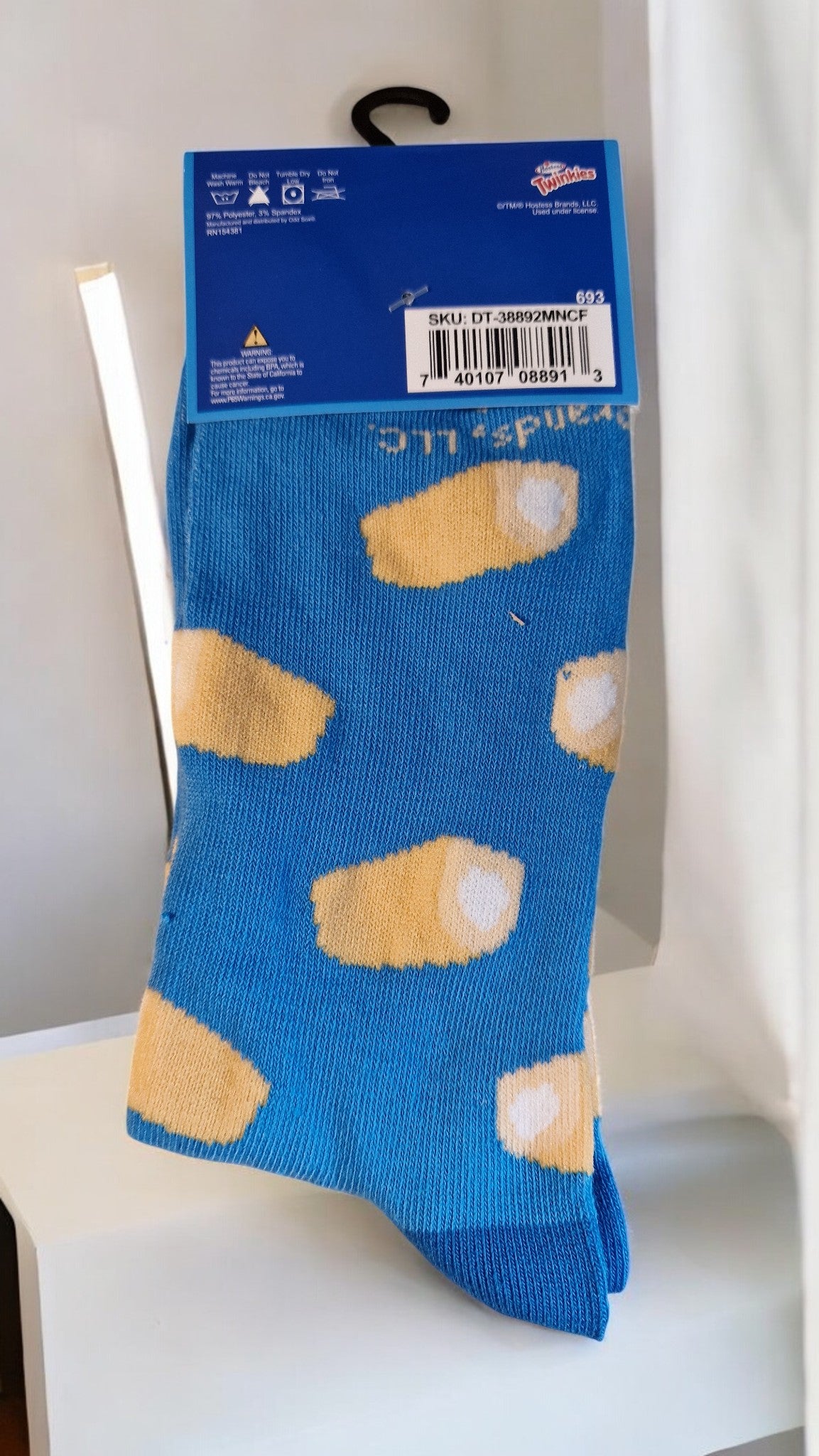 Blue sock with yellow shoe pattern on a white chair