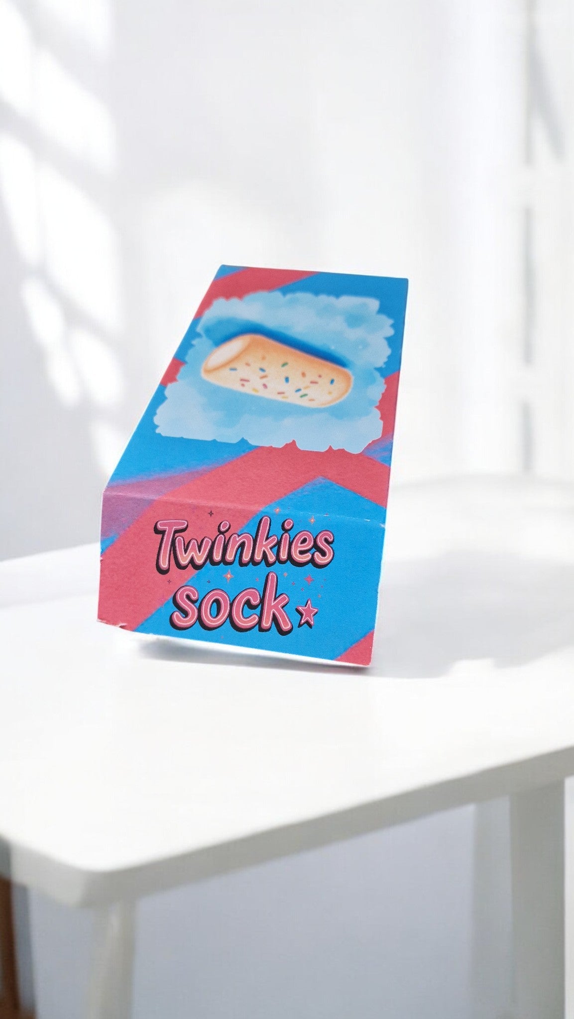 Box labeled 'Twinkies Sock' on a white surface