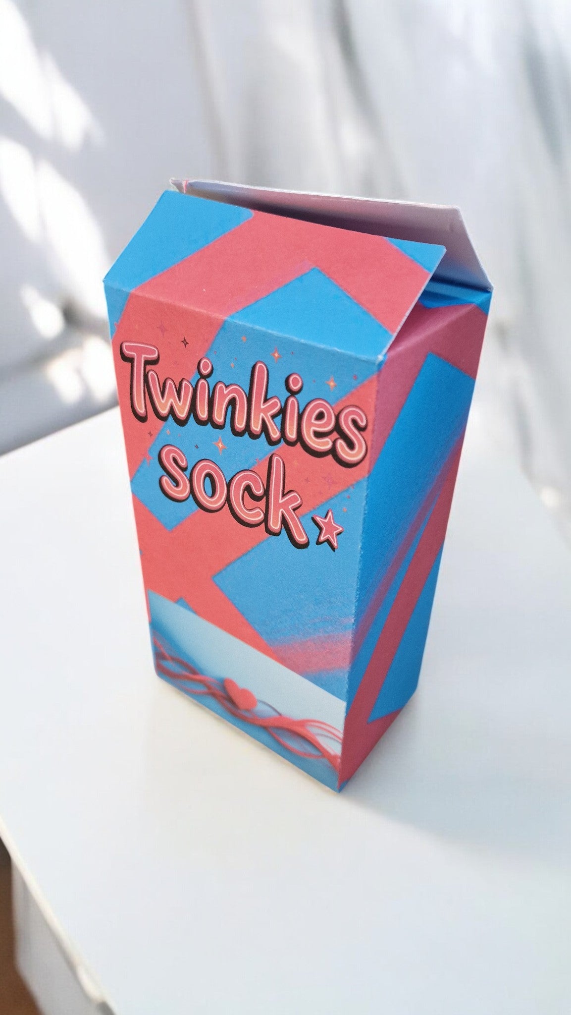 Blue and pink box labeled 'Twinkies sock' on a white background