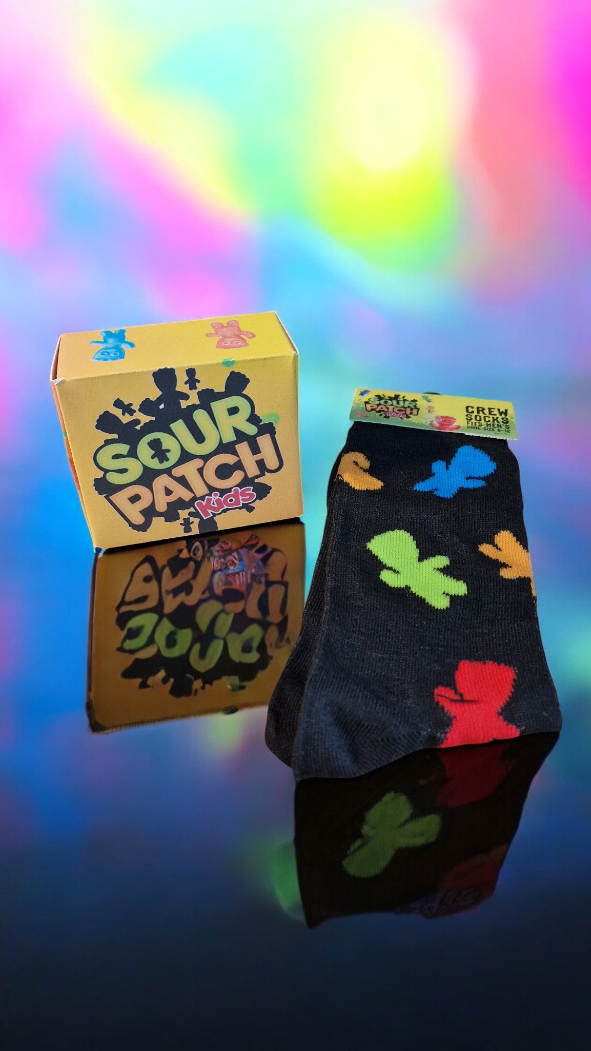 Sour Patch Kids-themed socks and packaging on a colorful background