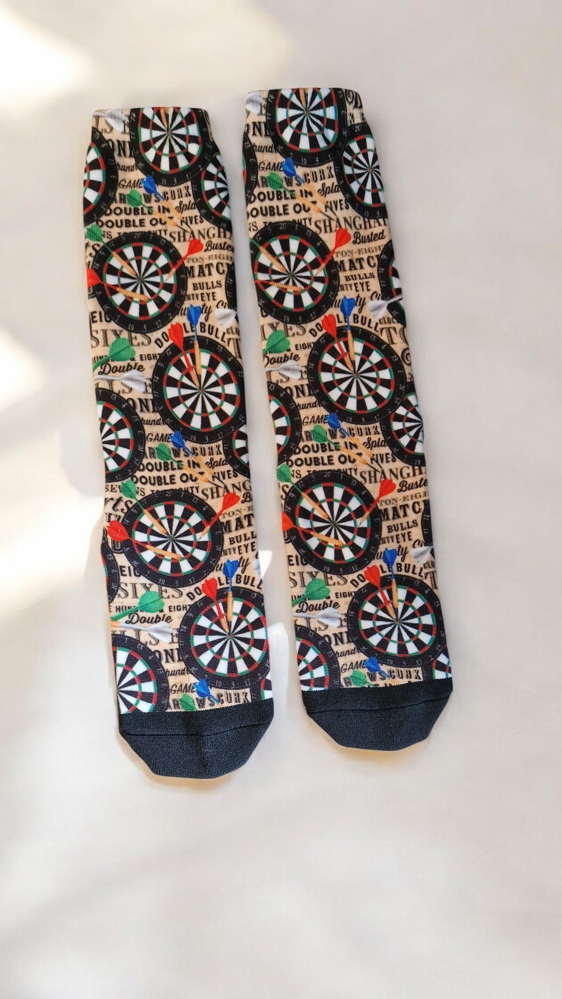 Pair of socks with dartboard pattern on a white background