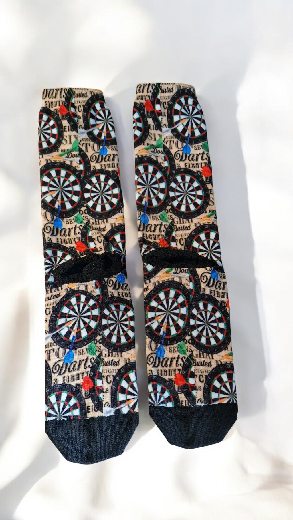Pair of socks with dartboard pattern on a white background