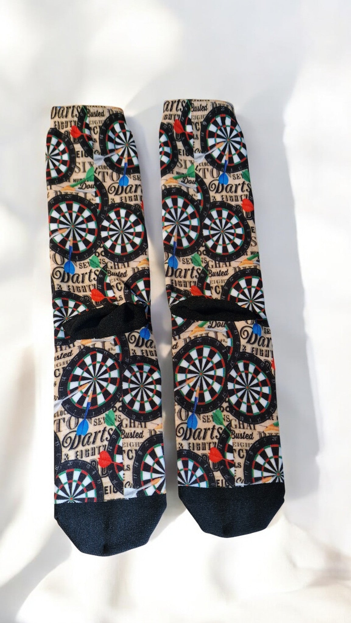 Pair of socks with dartboard pattern on a white background