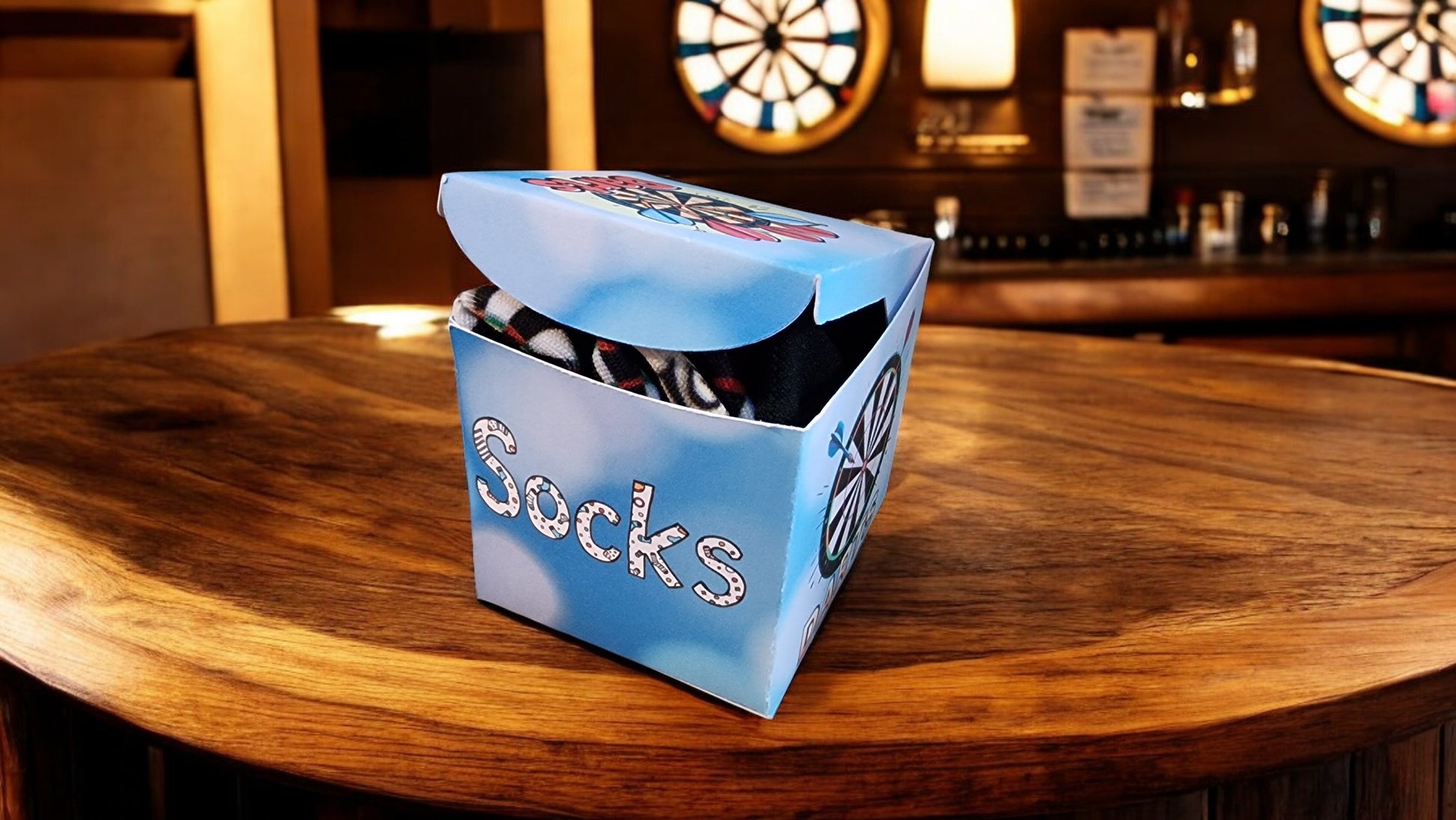 Box of socks on a wooden table with a bar in the background