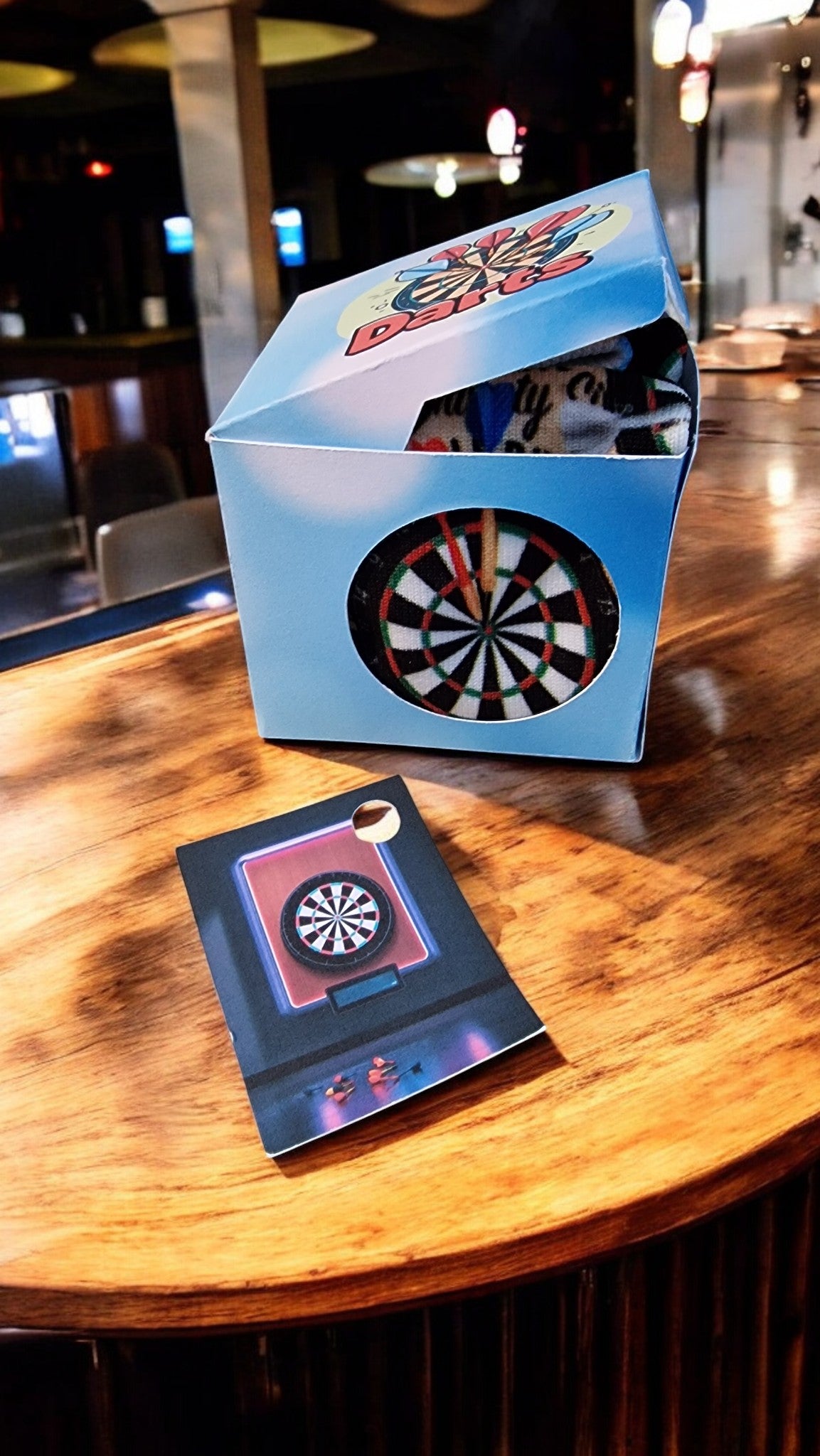 Dartboard game set on a wooden table with a blurred background