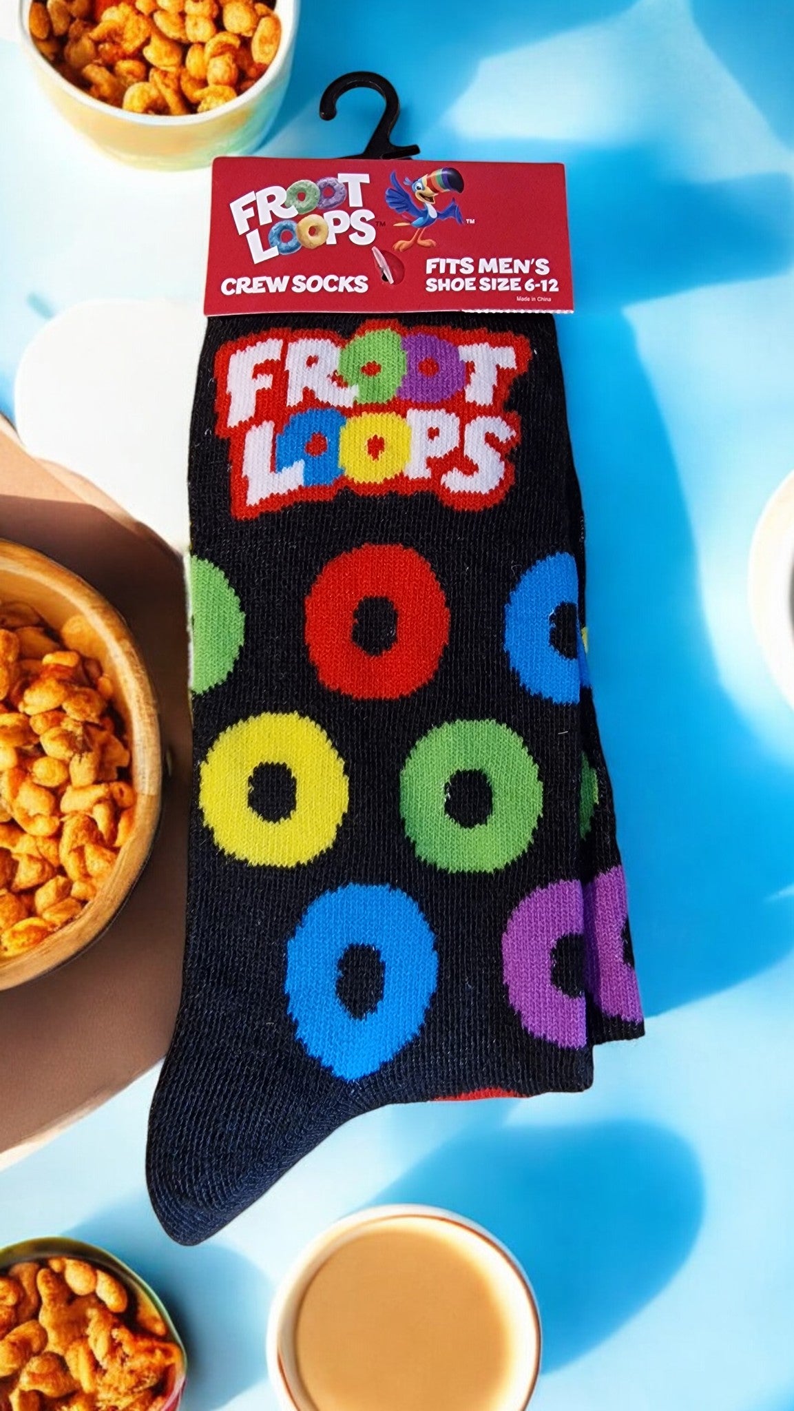 Froot Loops sock with colorful rings on a blue background