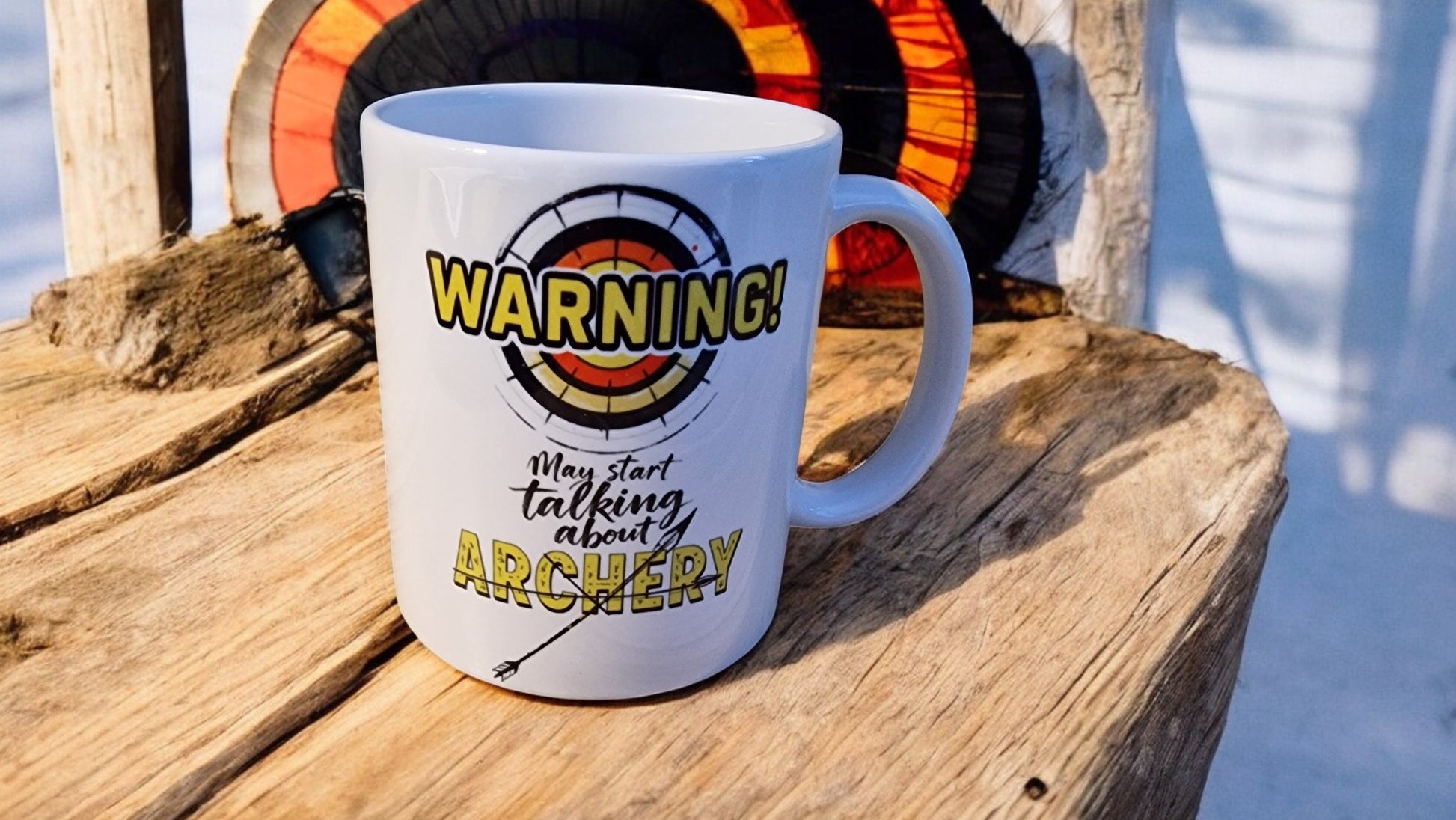 White mug with archery-themed text on a wooden surface