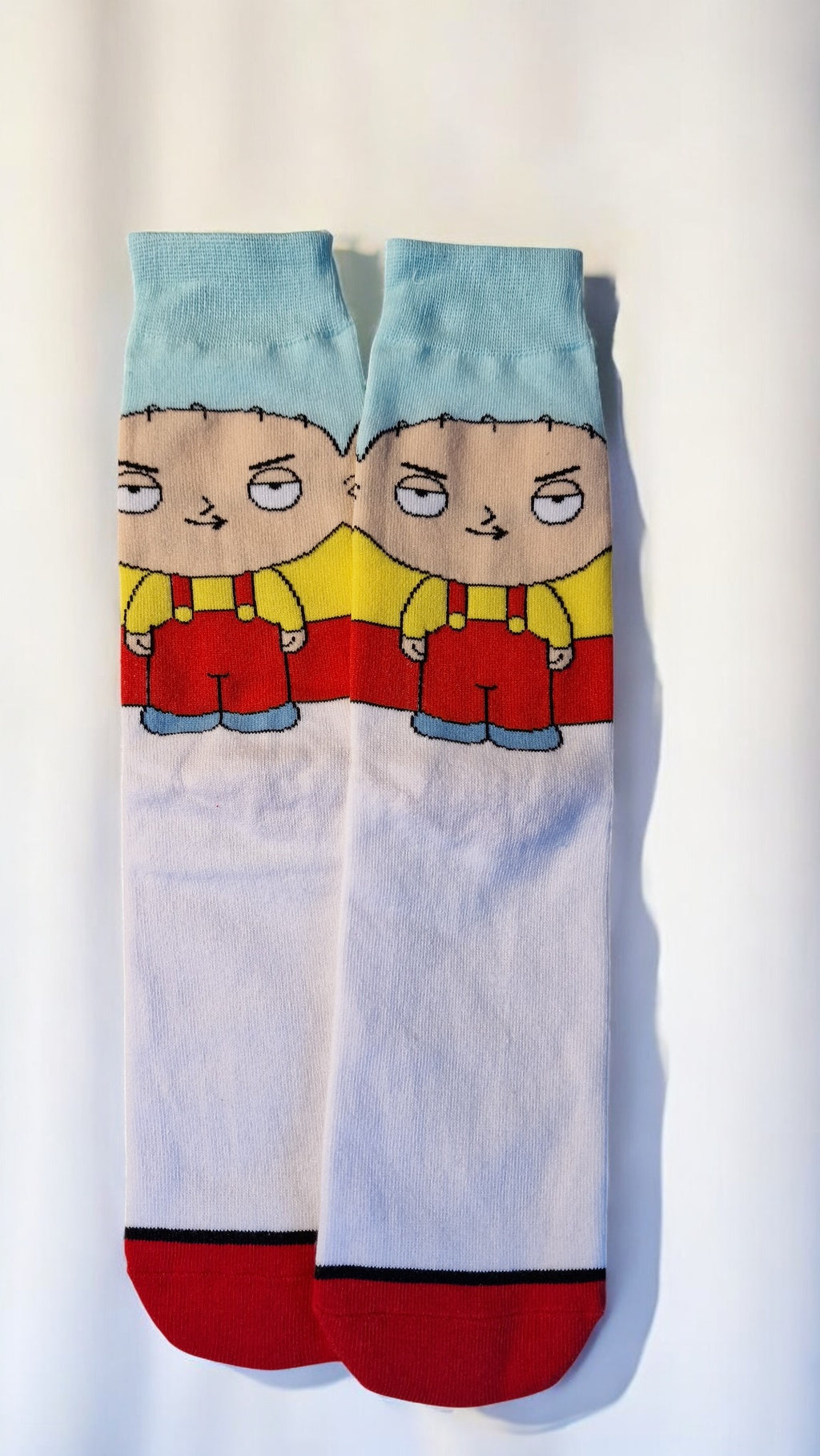 Pair of socks with cartoon character design on a white background