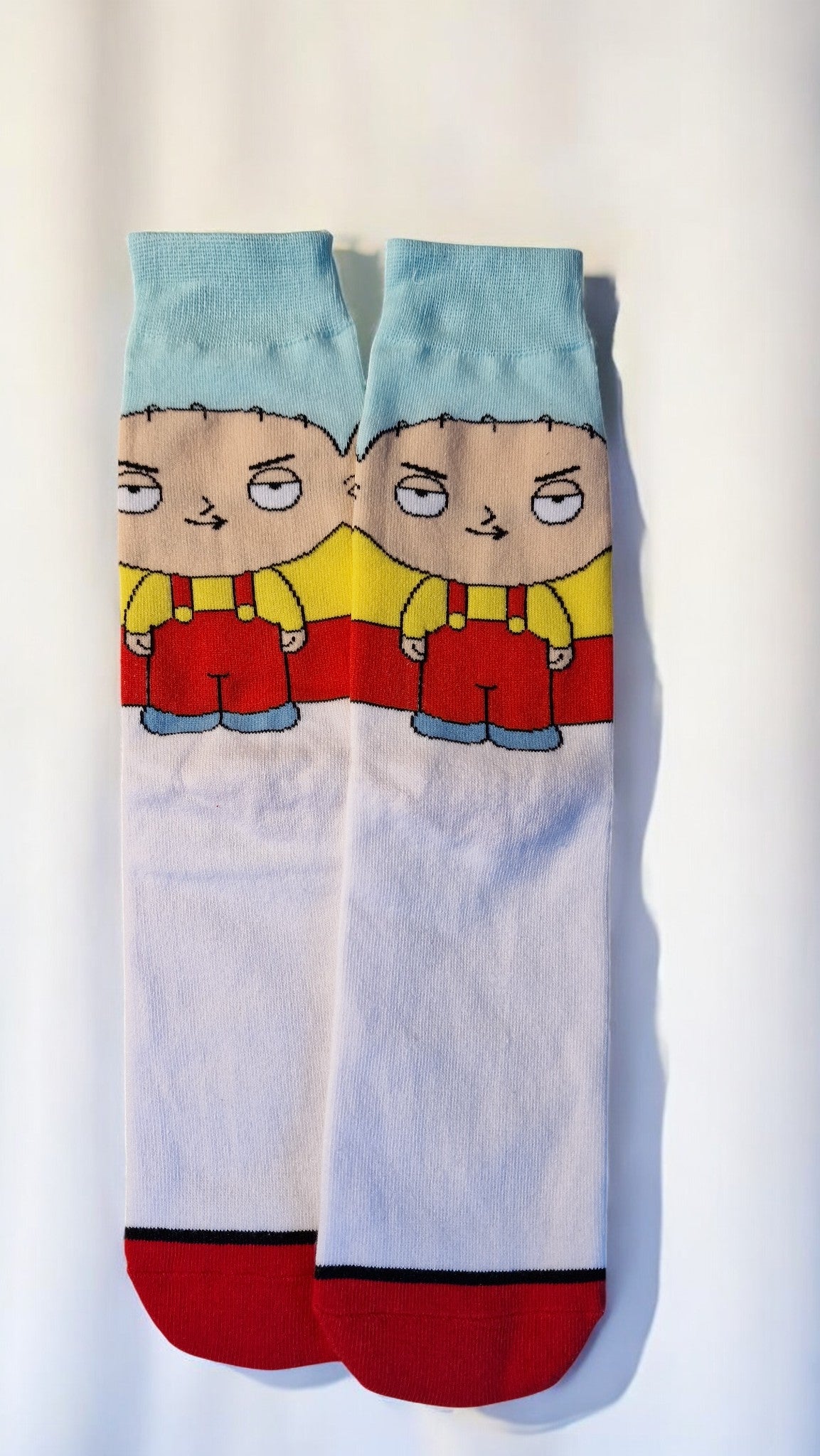 Pair of socks with cartoon character design on a white background