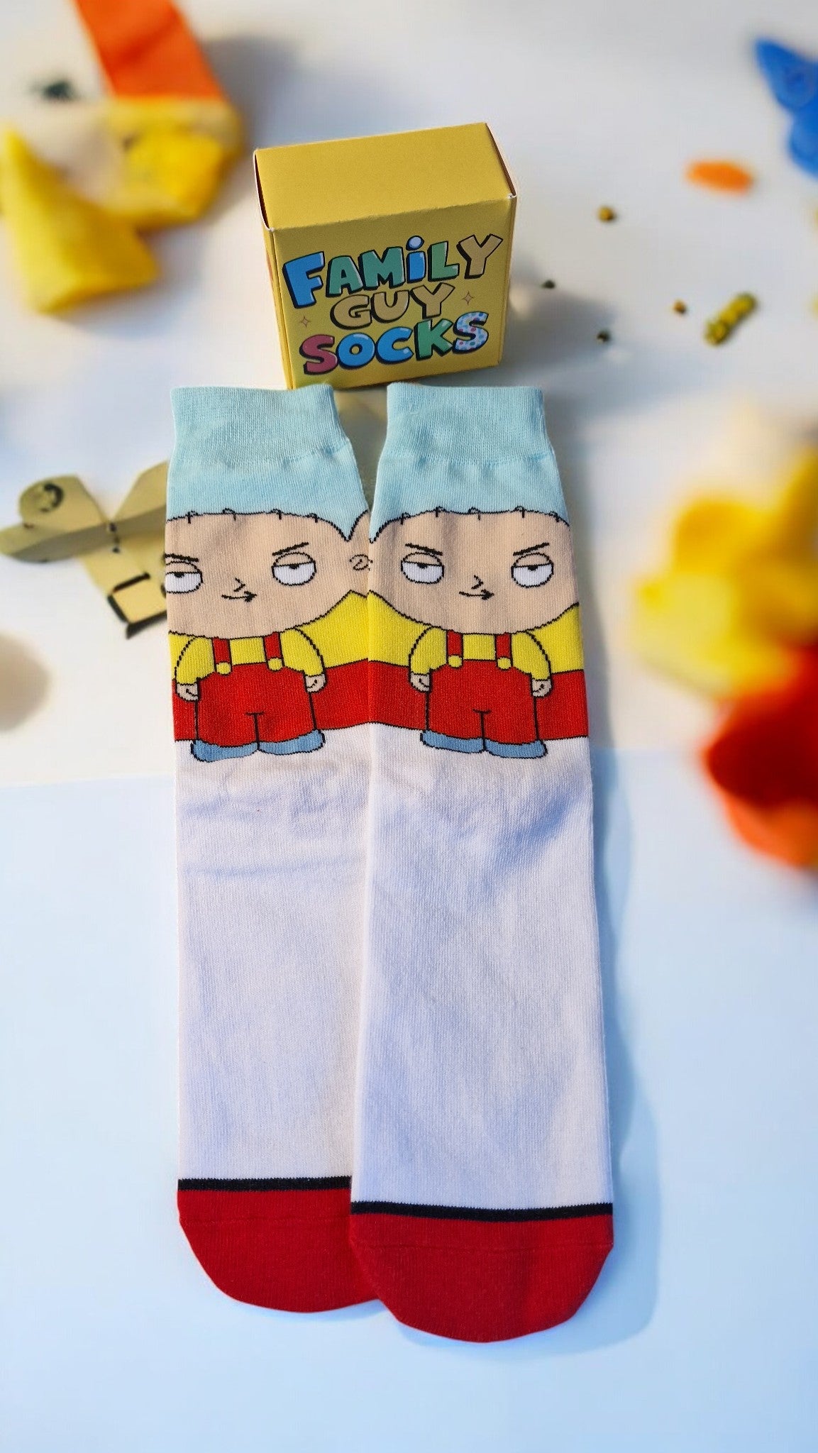 Cartoon-themed socks with a box labeled 'Family Guy Socks' on a colorful background.