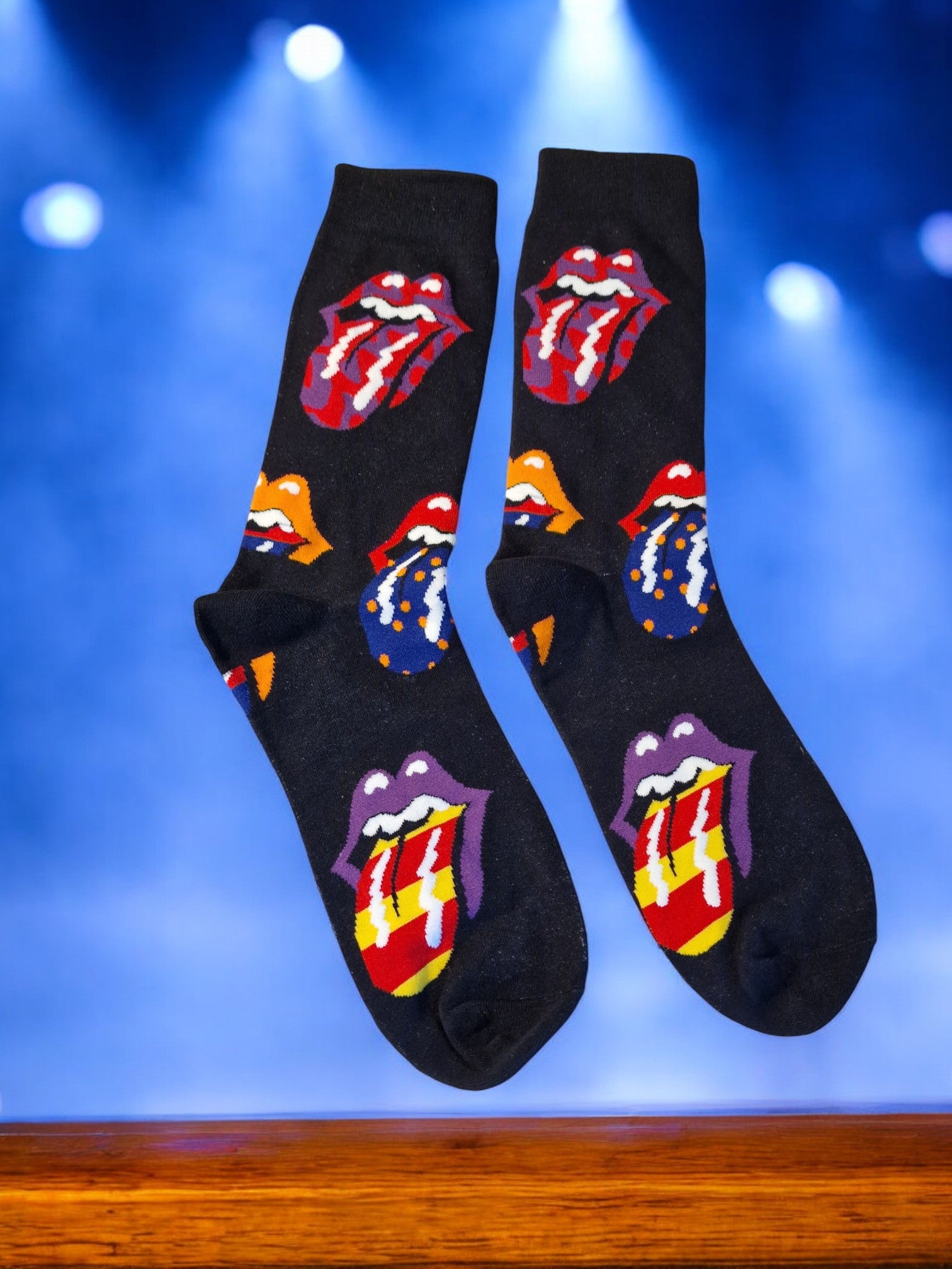 Black socks with Rolling Stones logo on a blue background